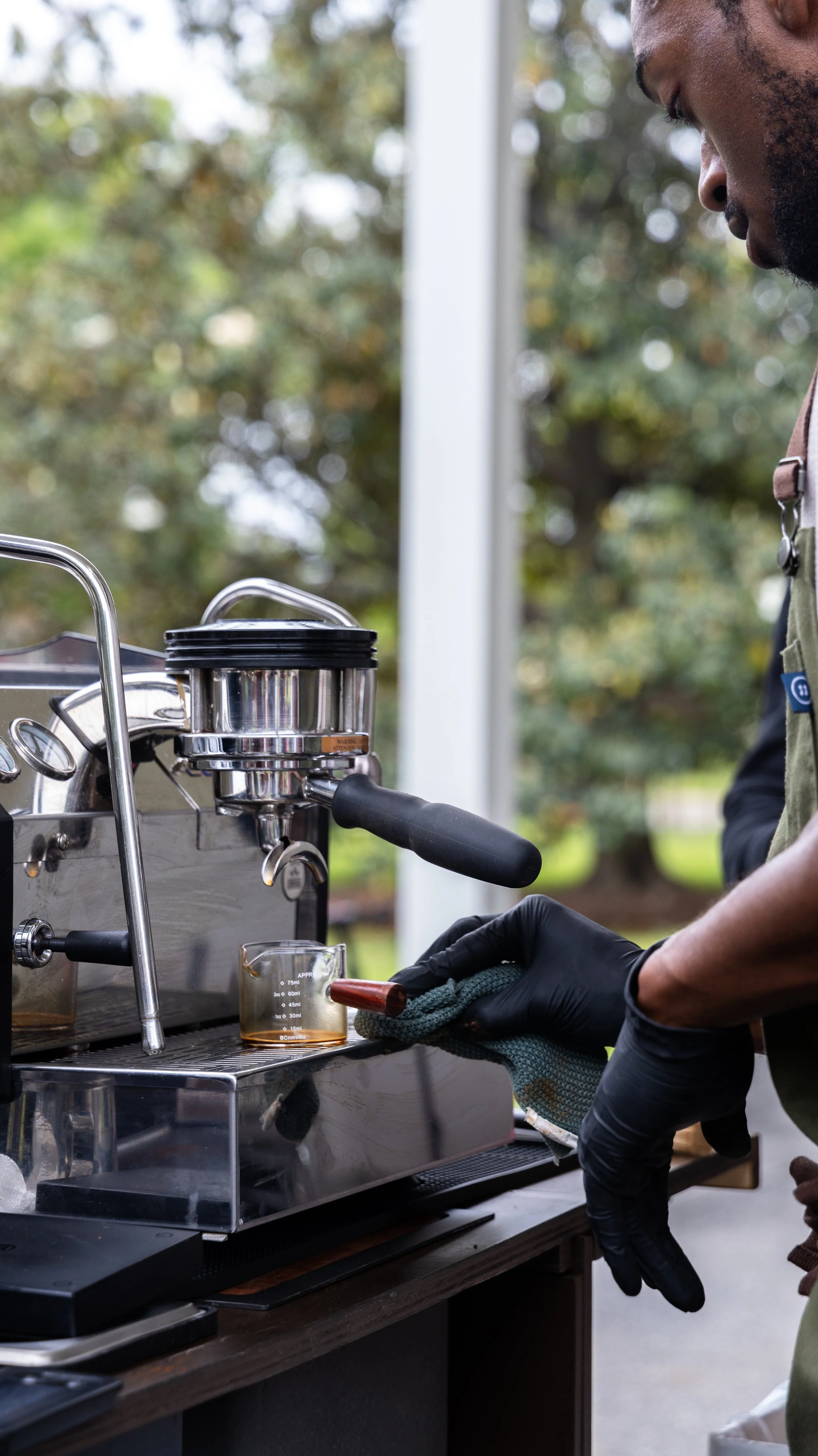 Barista preparing espresso at an Elsie's Coffee mobile espresso bar for a corporate event.