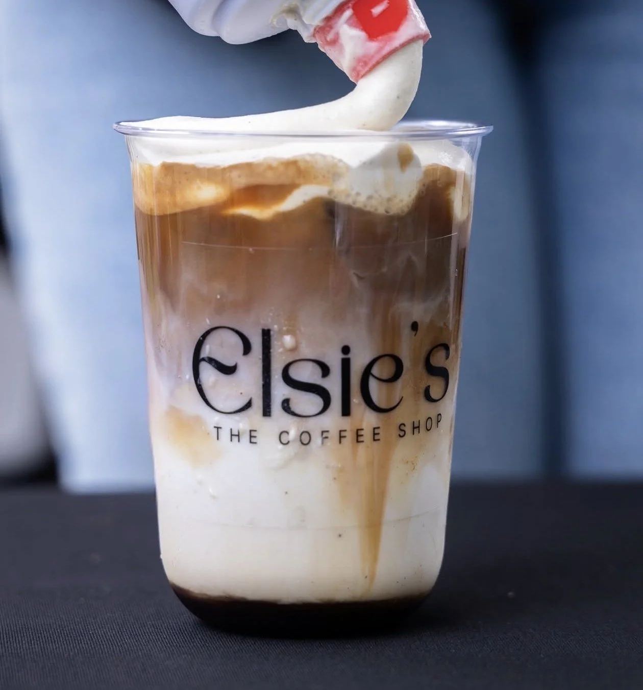 Elsie's Coffee signature iced drink served at a community pop-up event in Houston.