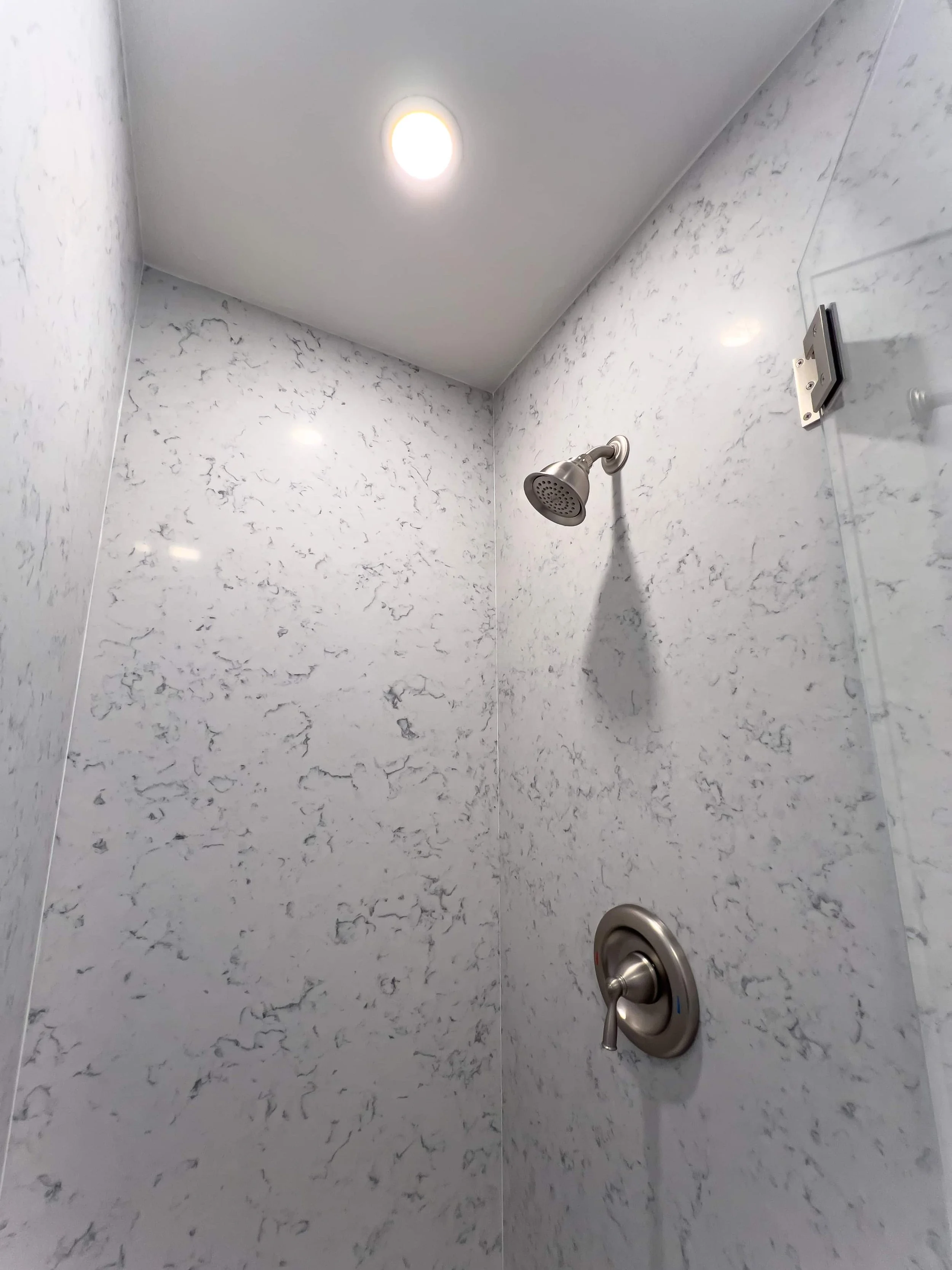 Marble shower surround in an ADU.