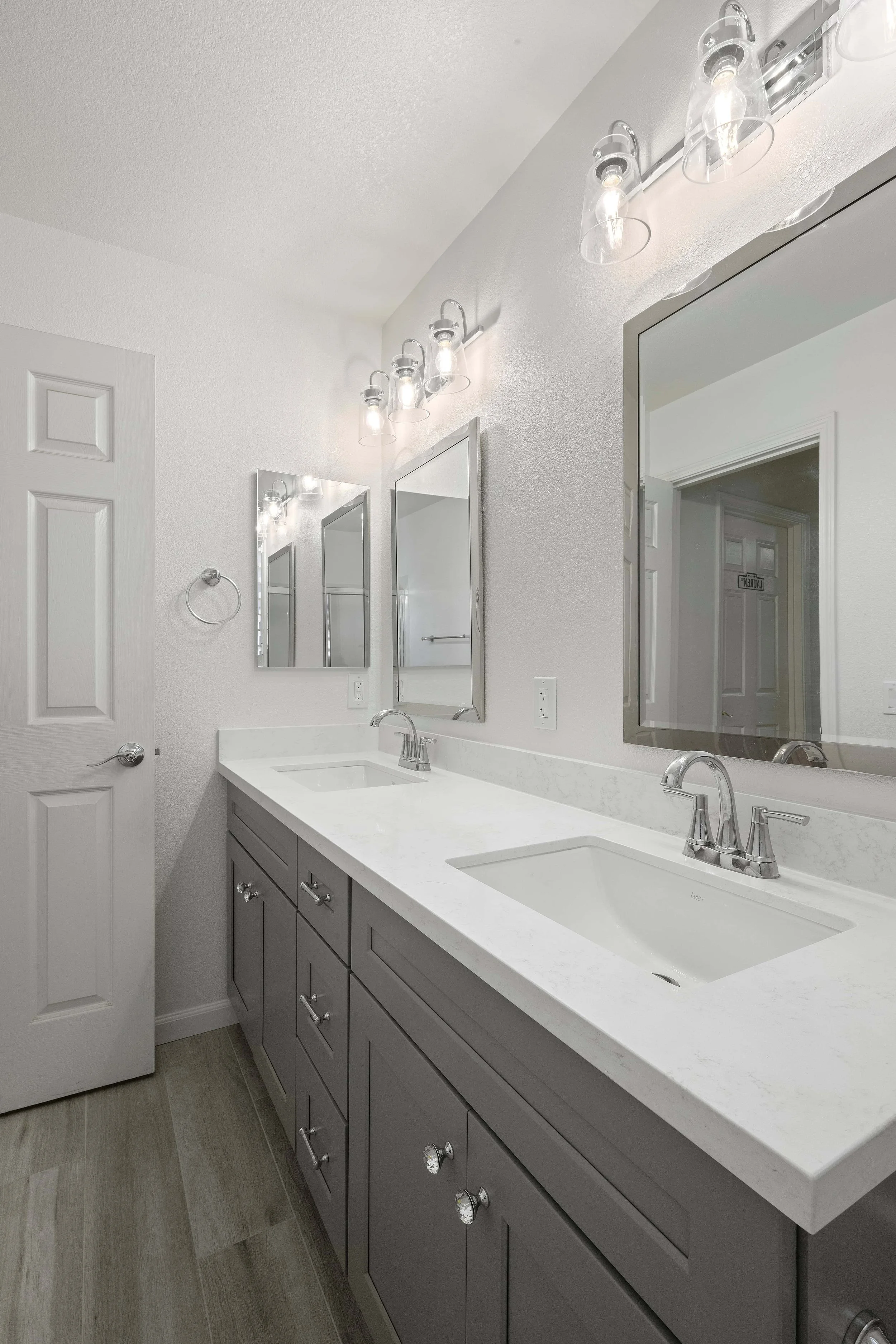 A grey vanity in a remodeled Cambrian Park bathroom, including double sinks.