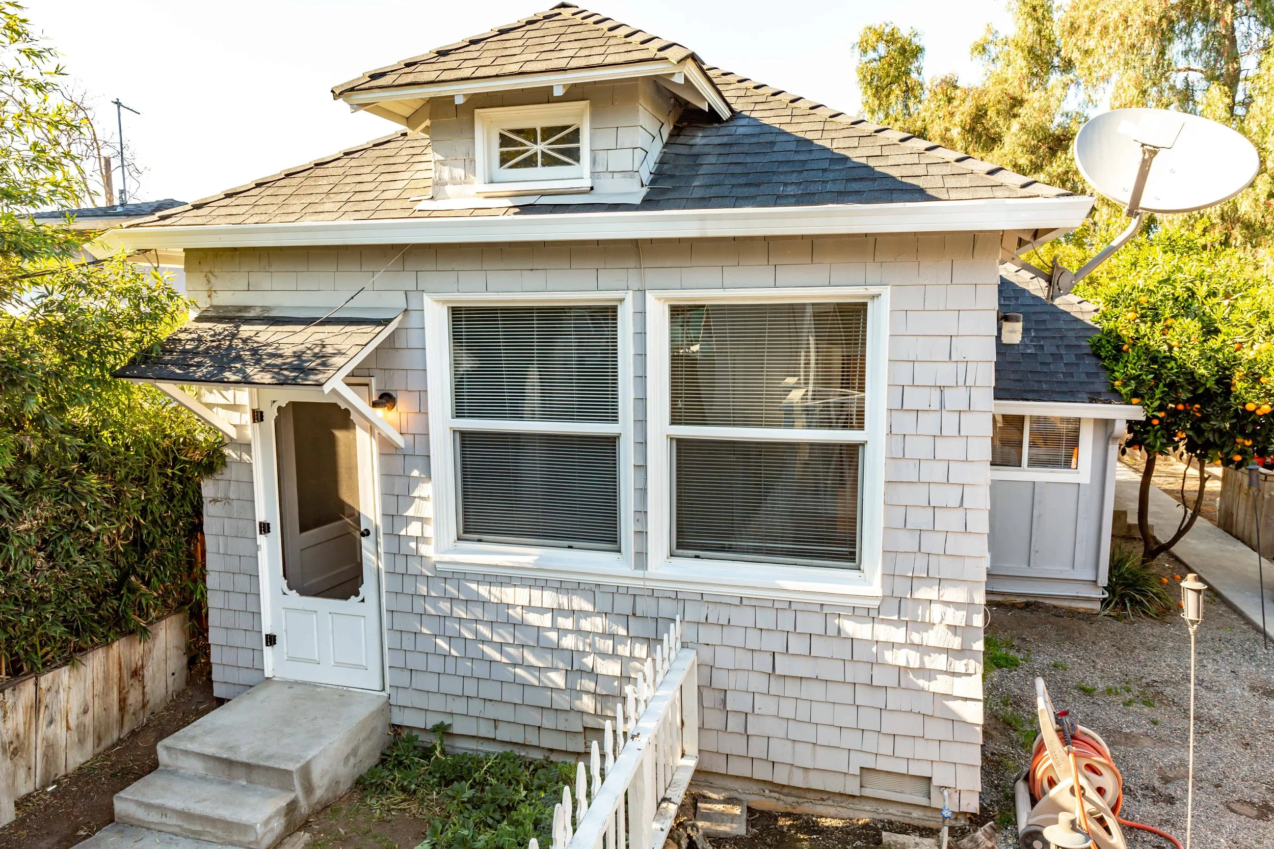 A white ADU in Silicon Valley, featuring cedar shake shingles on the exterior.