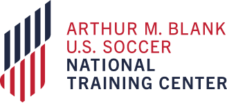 Logo for the Arthur M. Blank U.S. Soccer National Training Center with red, black, and blue stripes and text.