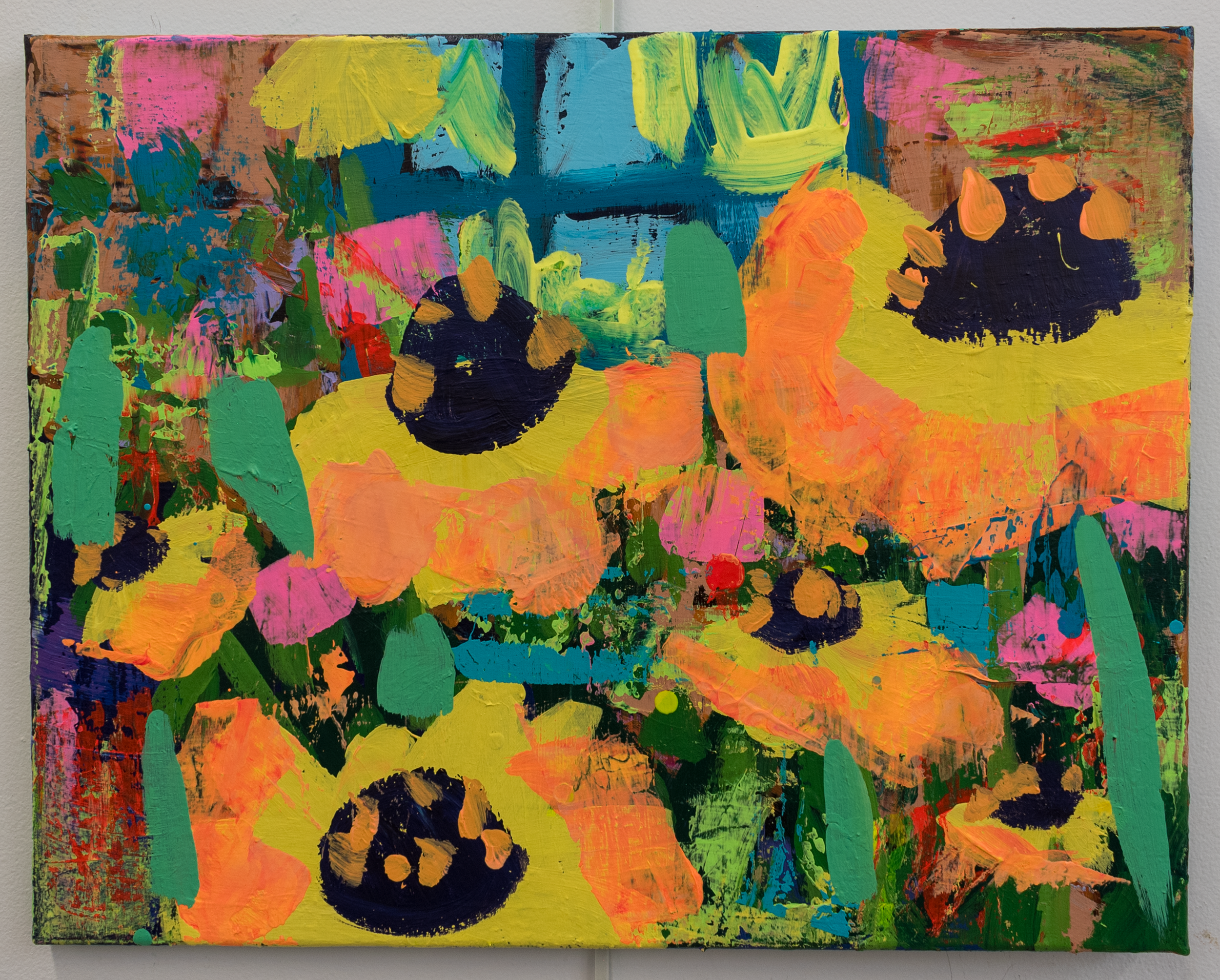 A colorful abstract painting on a rectangular canvas with various bright colors and textured brushstrokes.