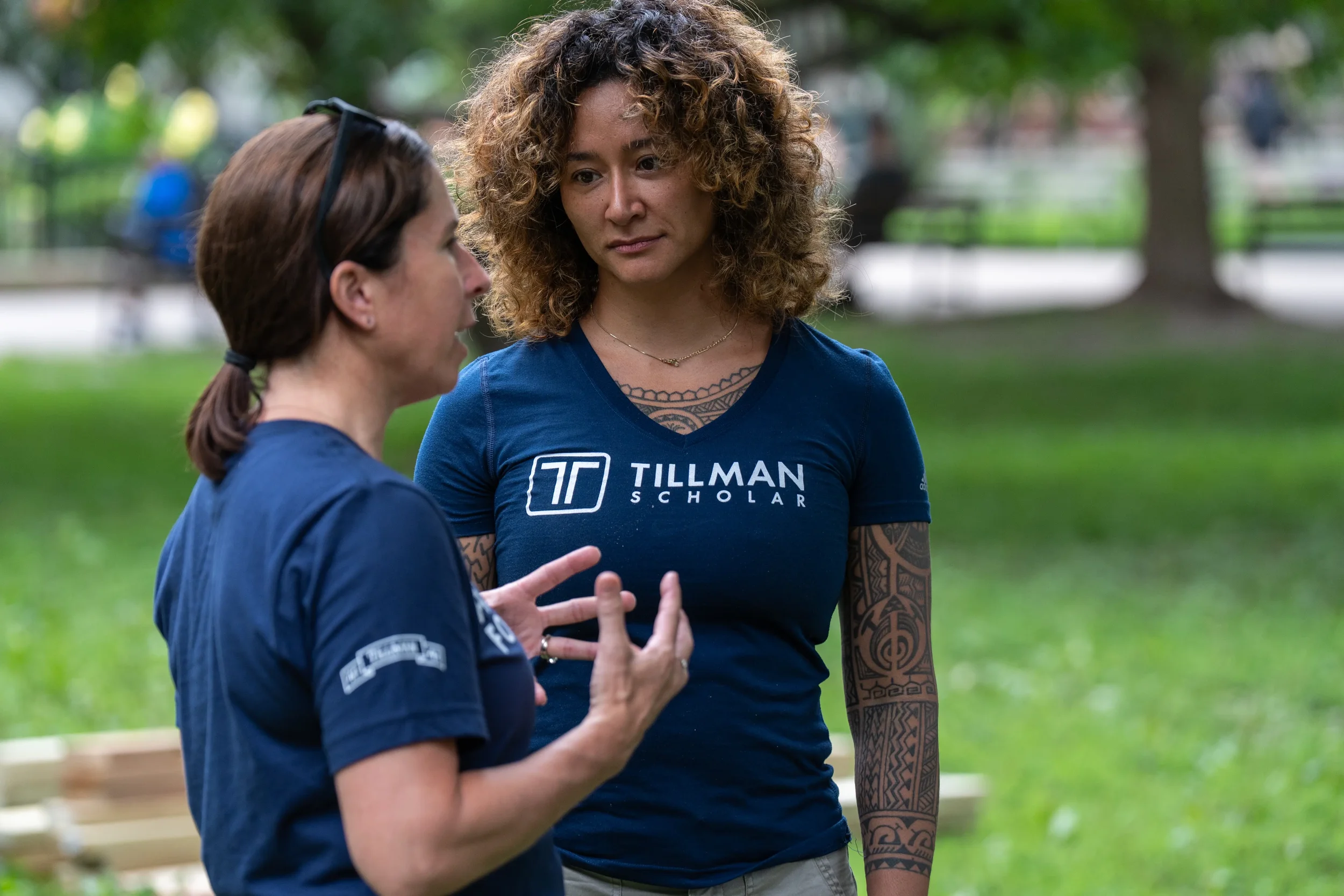 Samantha Juan speaking with another participant during an outdoor community event at Workhouse Arts Center.