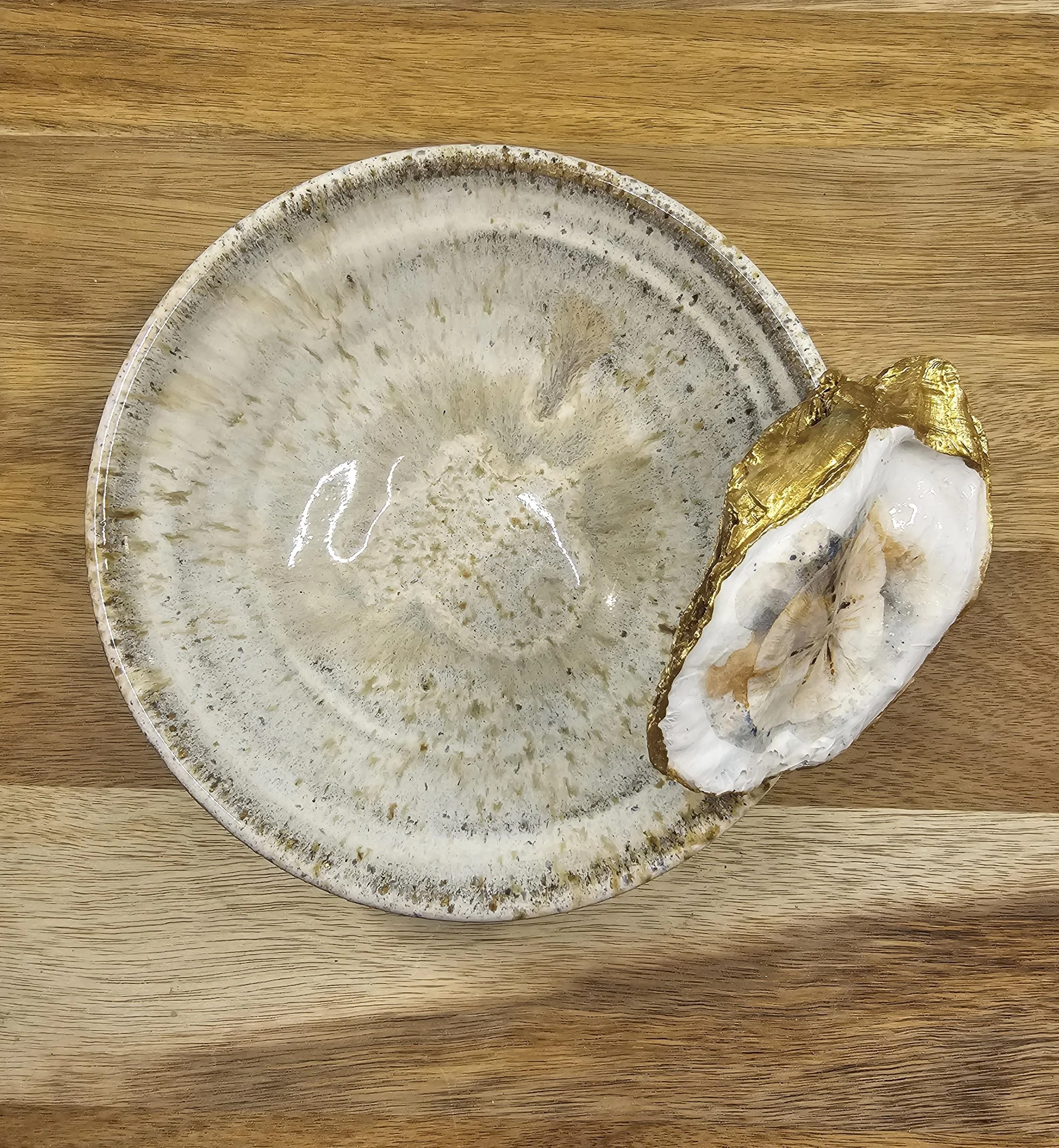 Cream Speckled Bowl with two bounded Oyster Shells top view.jpg