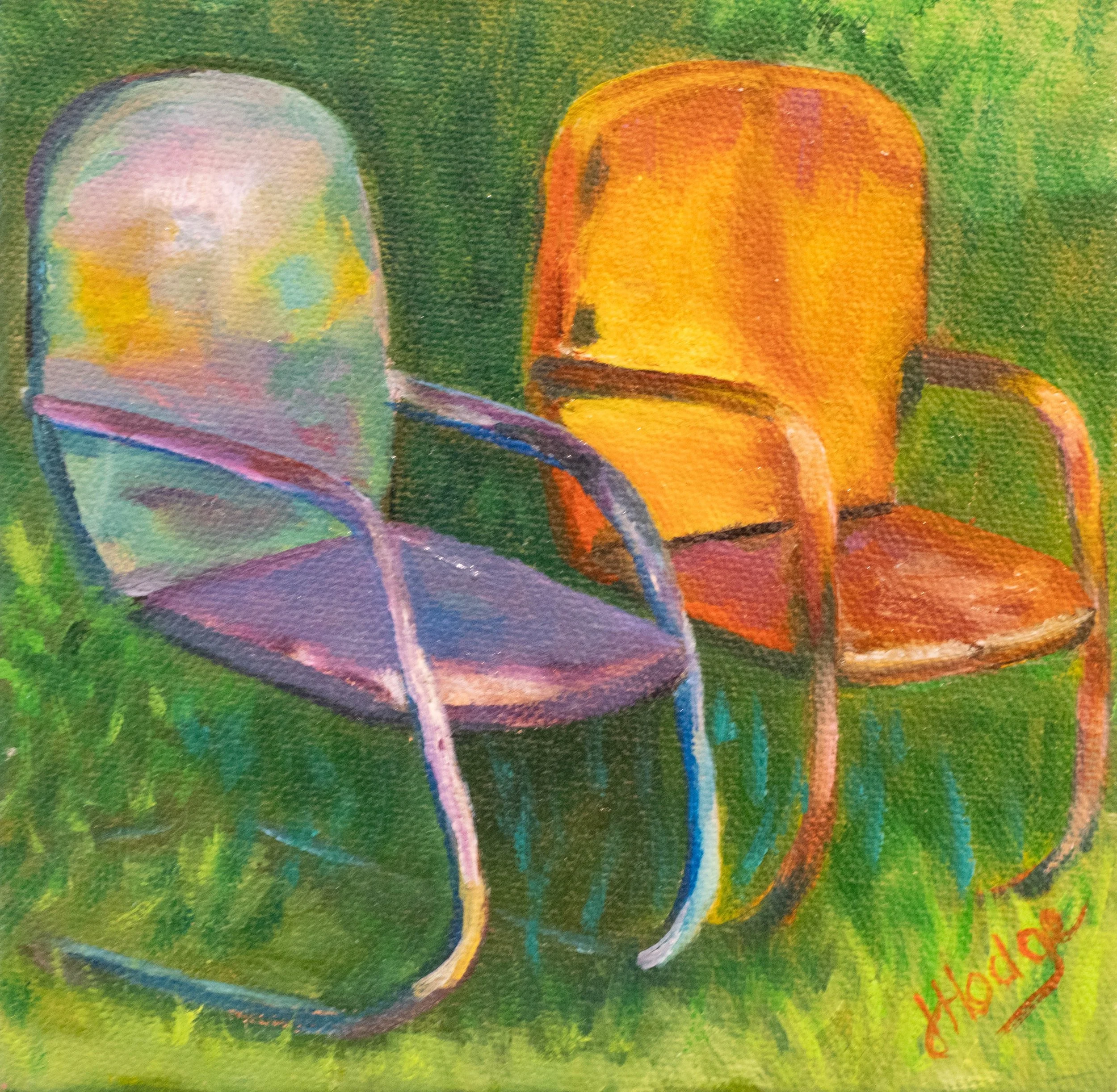 Close-up of a watercolor painting of two apples on green background