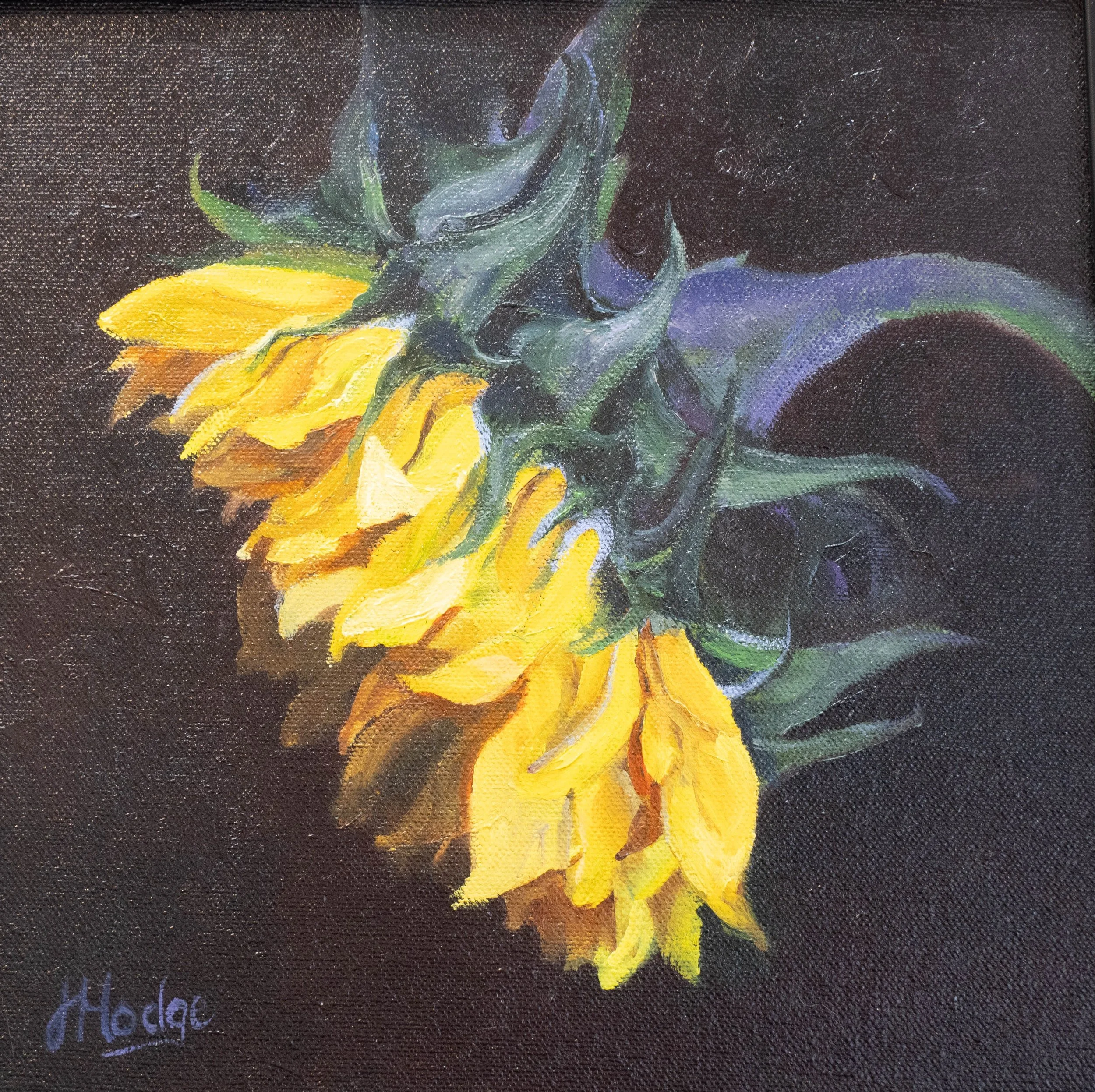 Close-up of a painted sunflower with yellow petals and green leaves on a dark background.