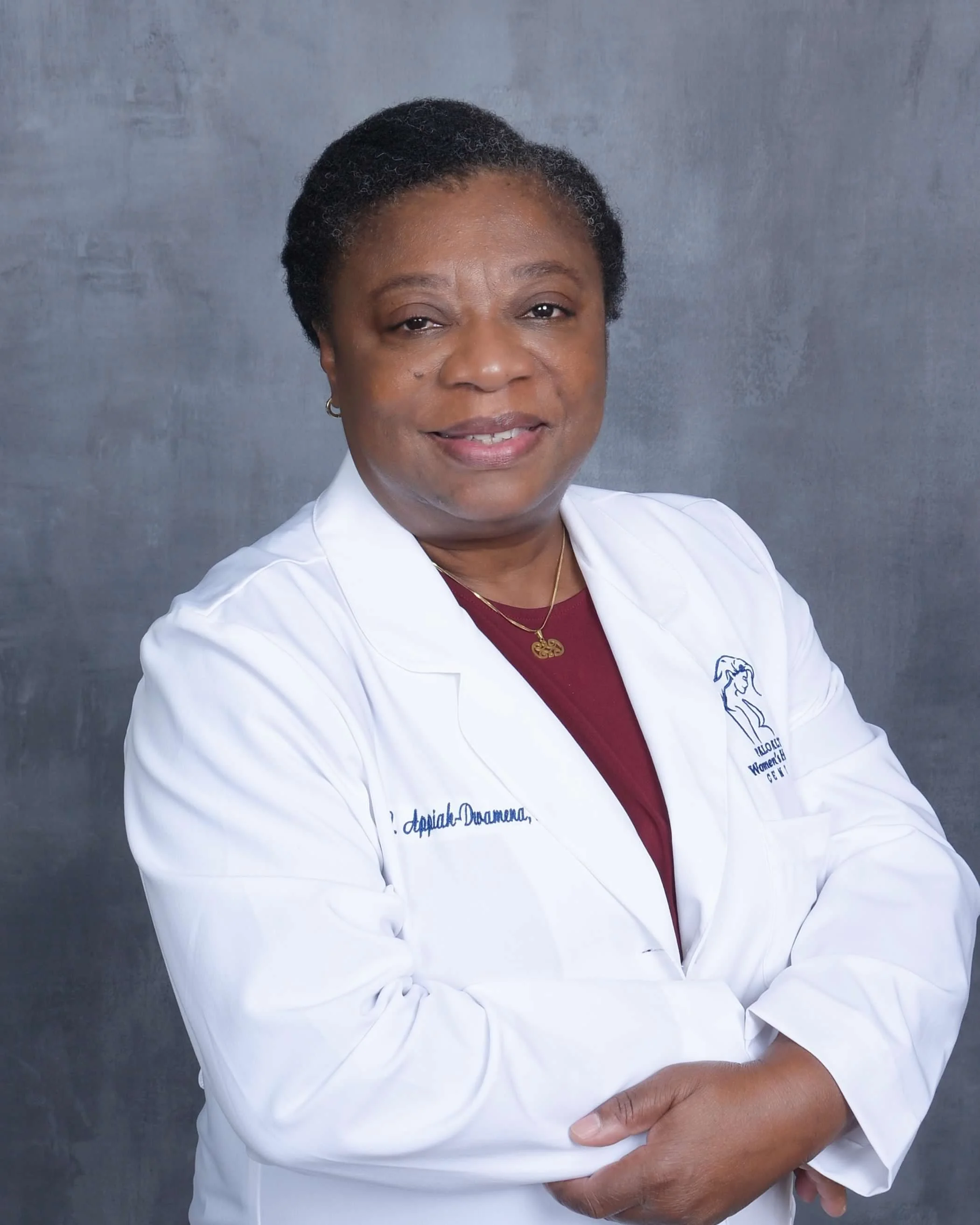 Our Provider Dr. Lydia Appiah Dwamena wearing her White Coat