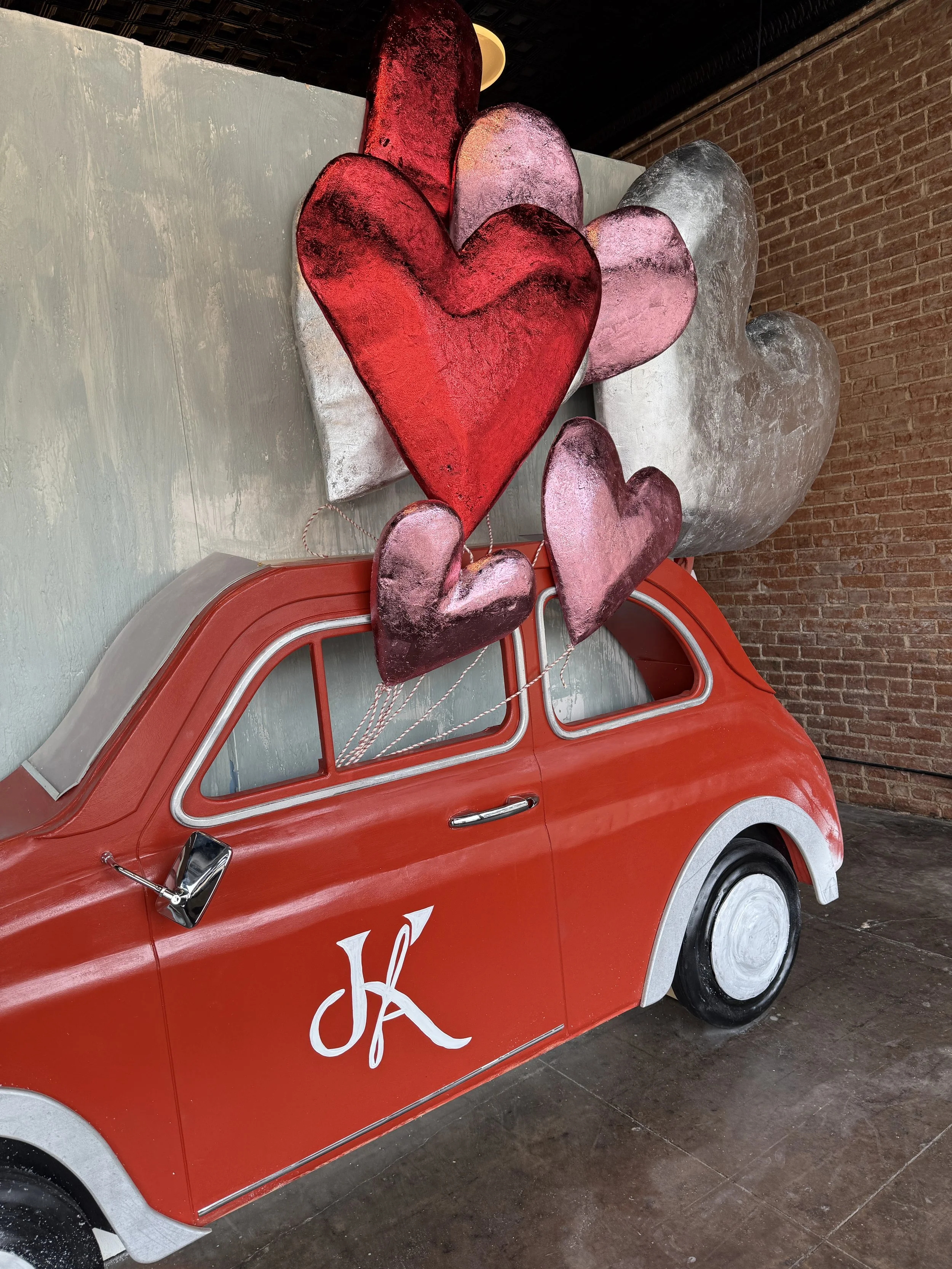 Carved wood car, carved mettalic foam hearts | Designer, fabricator, installer | The Kinfolk, Clifton, TX