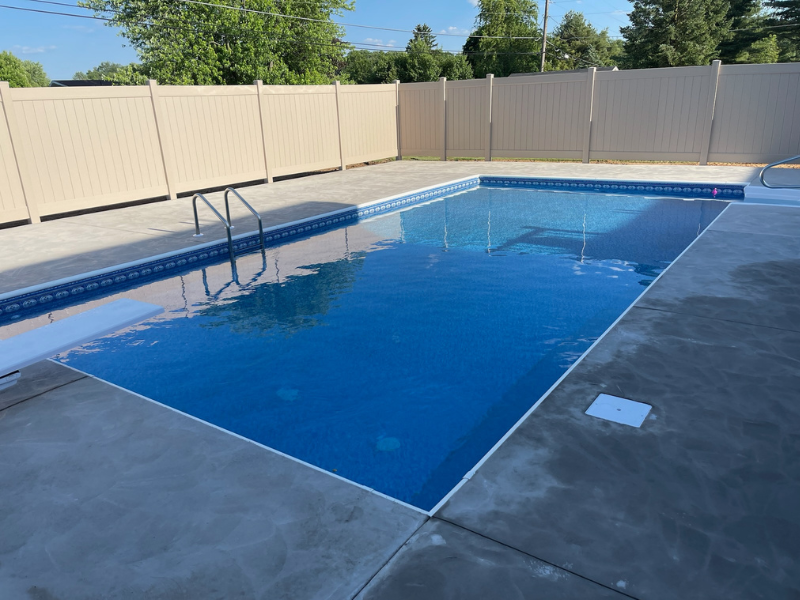 Recently completed in-ground swimming pool featuring a new liner and updated pool equipment.