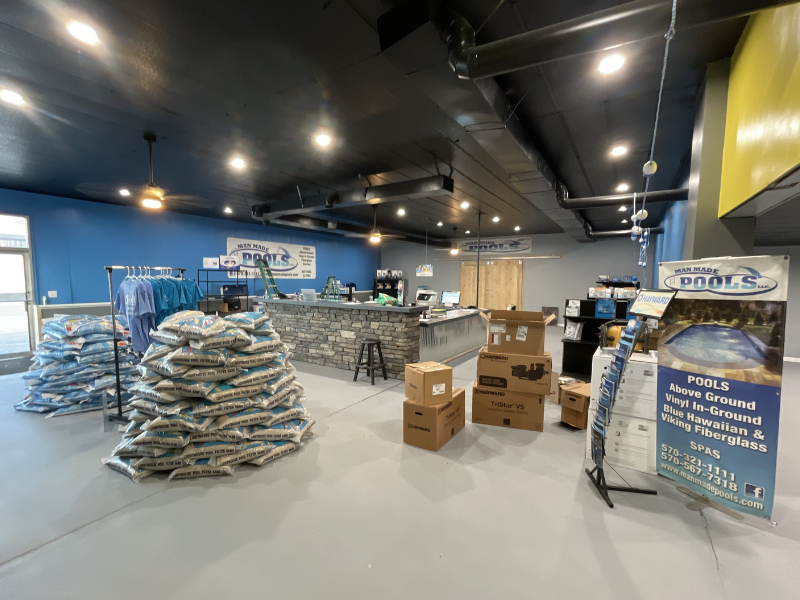 Interior of the Man Made Pools retail store featuring pool chemicals, supplies, accessories, and replacement parts.