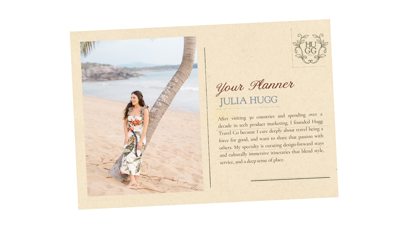 A woman in a floral dress standing on a sandy beach with a palm tree leaning over her, ocean waves in the background, and a partly cloudy sky.