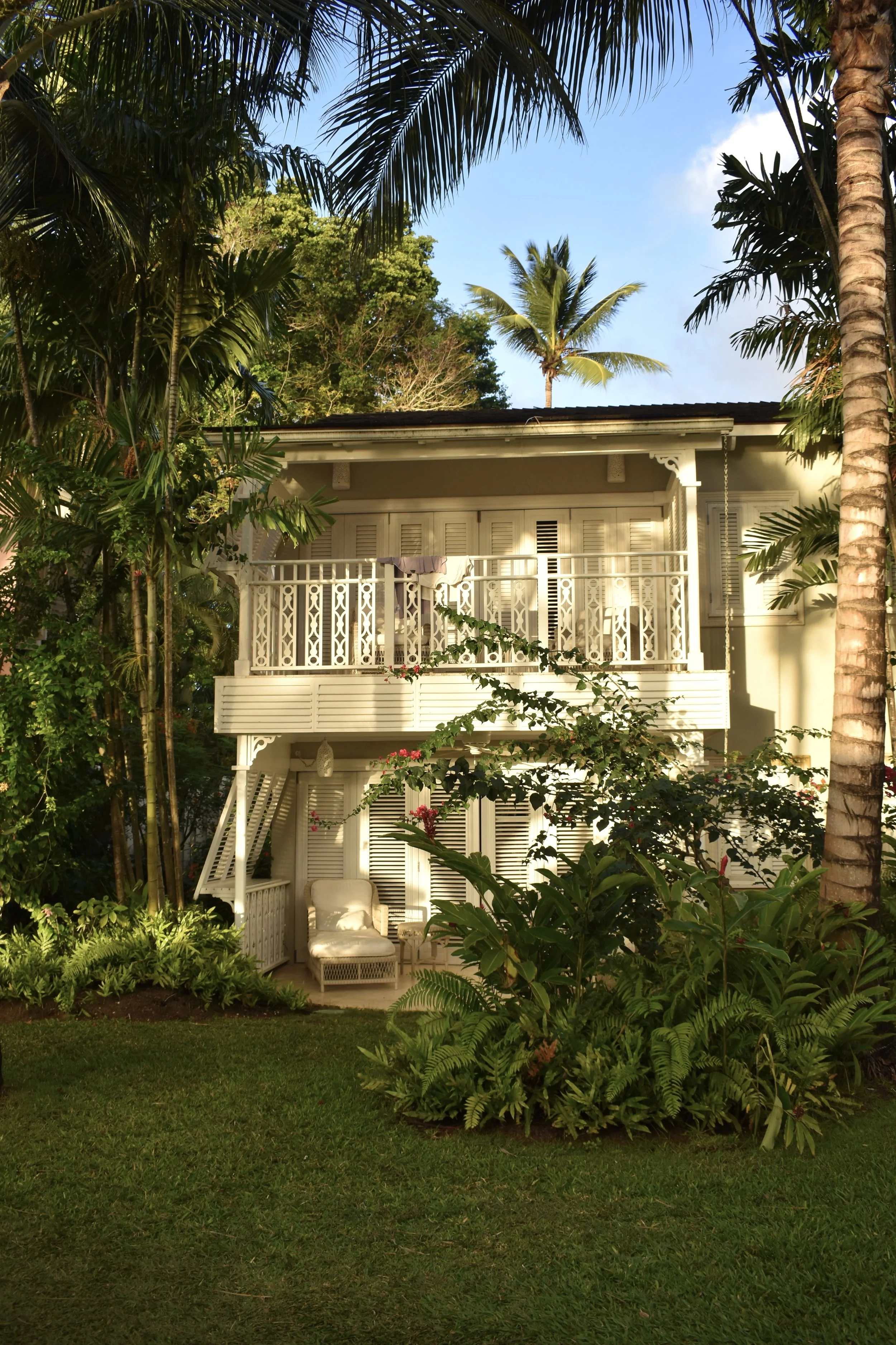 A standalone cottage part of Cobbler's Cove resort in Barbados, featuring colonial design and charming accents.