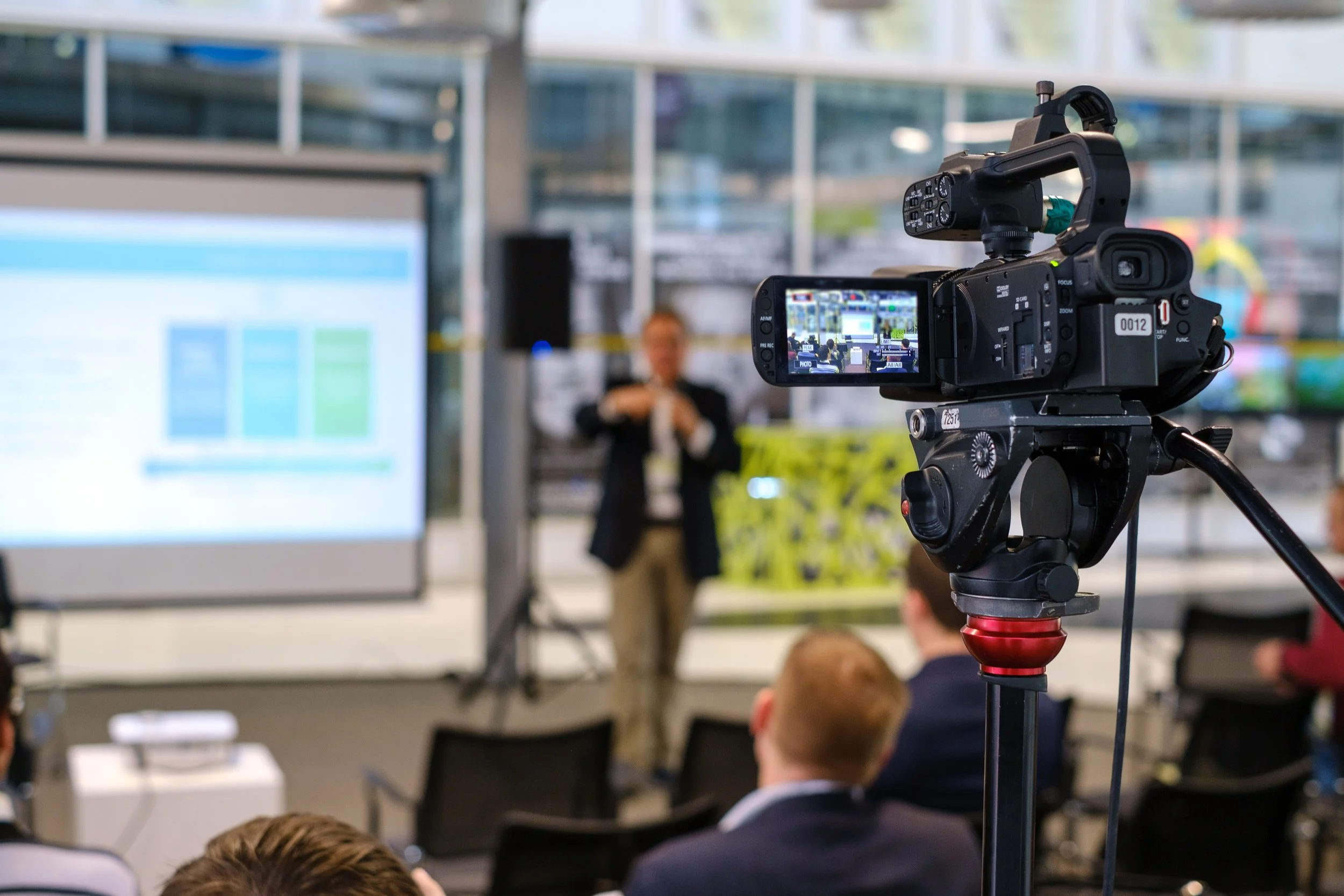 Video camera filming presenter