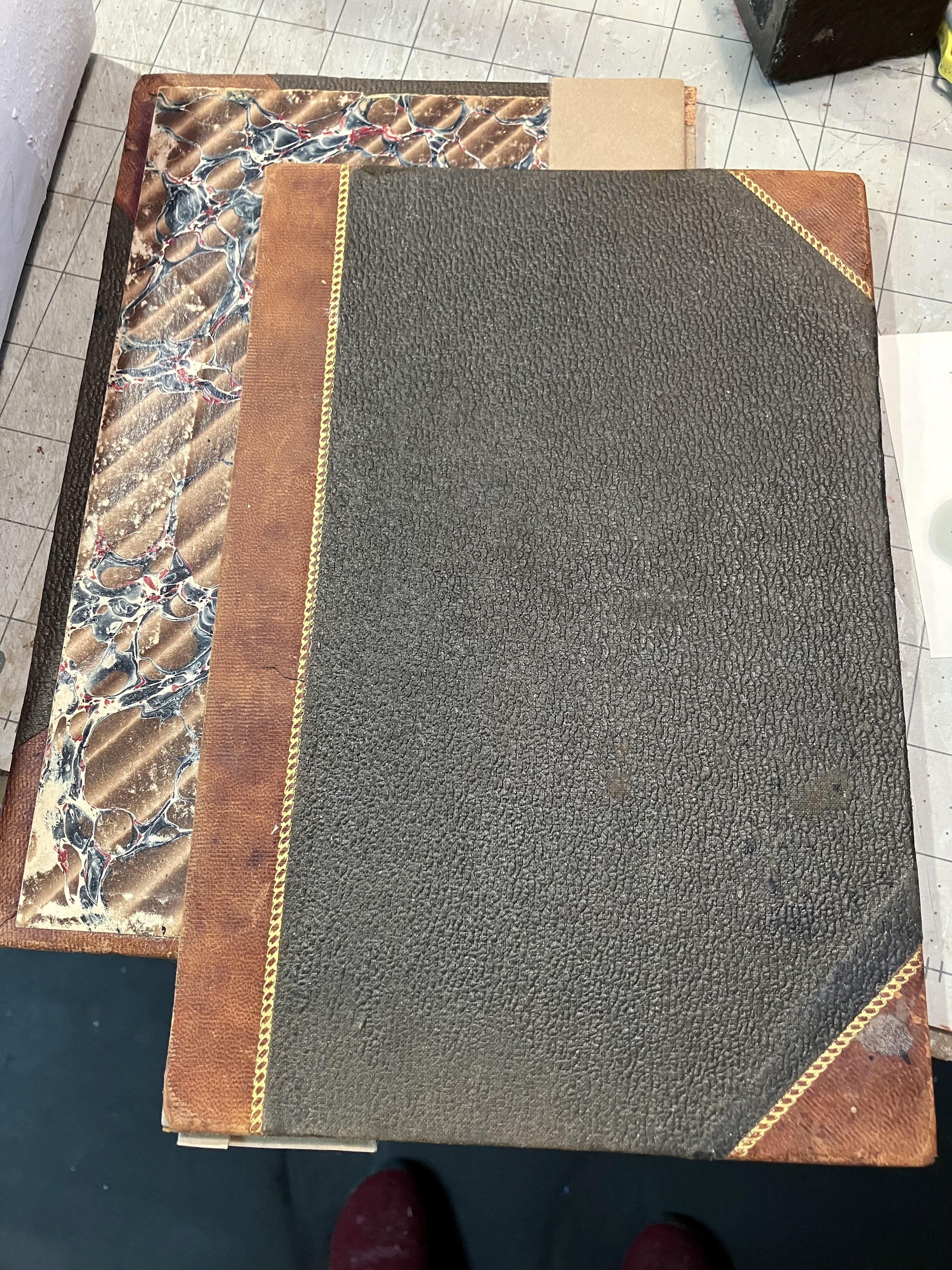Cover and inside of a vintage, bound book