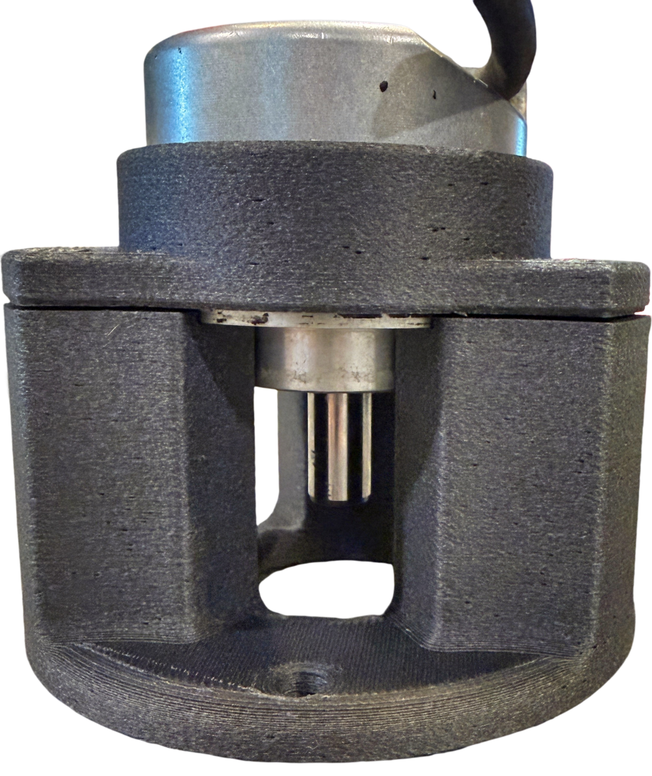 Close-up of a metal mechanical component with a cylindrical shape, featuring a central hole and a small gear inside.