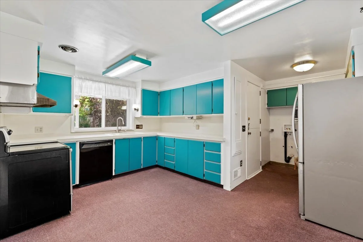 Before · The kitchen with the laundry area open to the room.