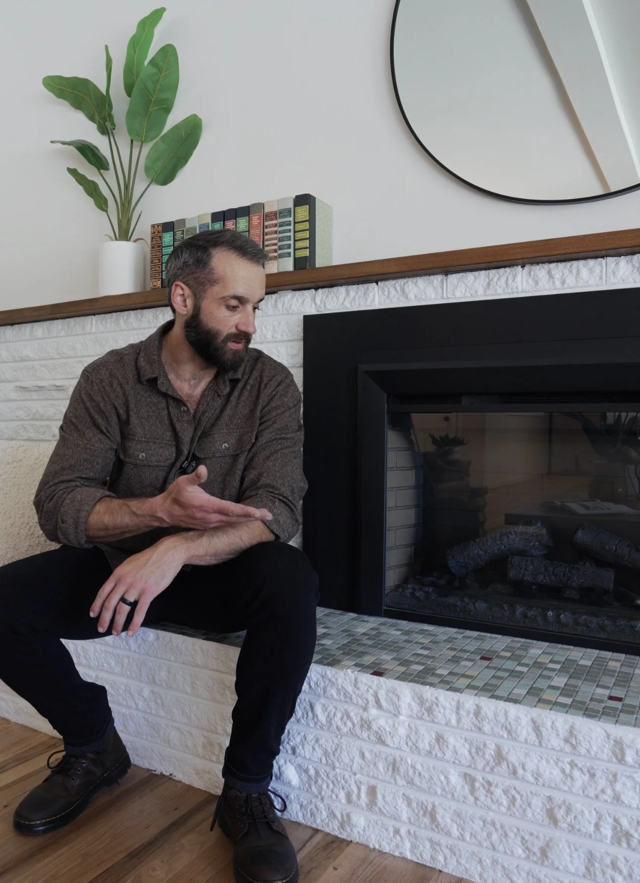 Carson Lovett speaking in the completed Balsam living room.