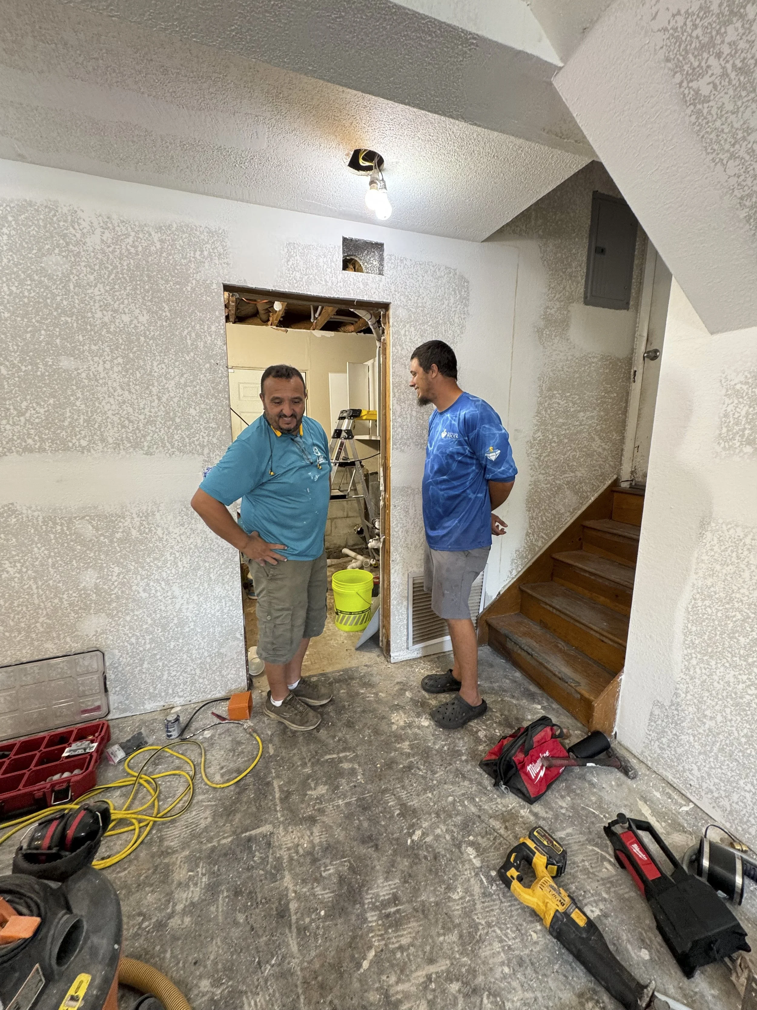 LG2 Services project manager Larbi Gaulin discussing custom bathroom floor plans and ADA accessibility modifications during a client consultation in Jacksonville, FL.