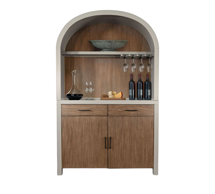 Arched wooden bar cabinet holding glassware and bottles