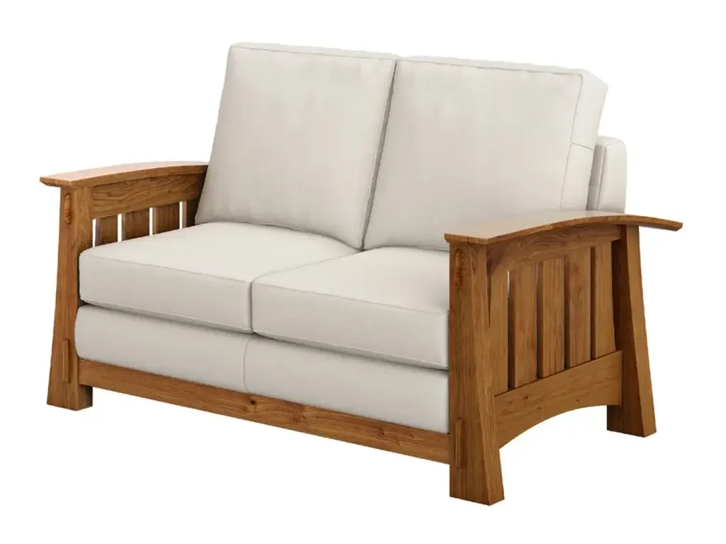A white sofa with wooden arms and frame.