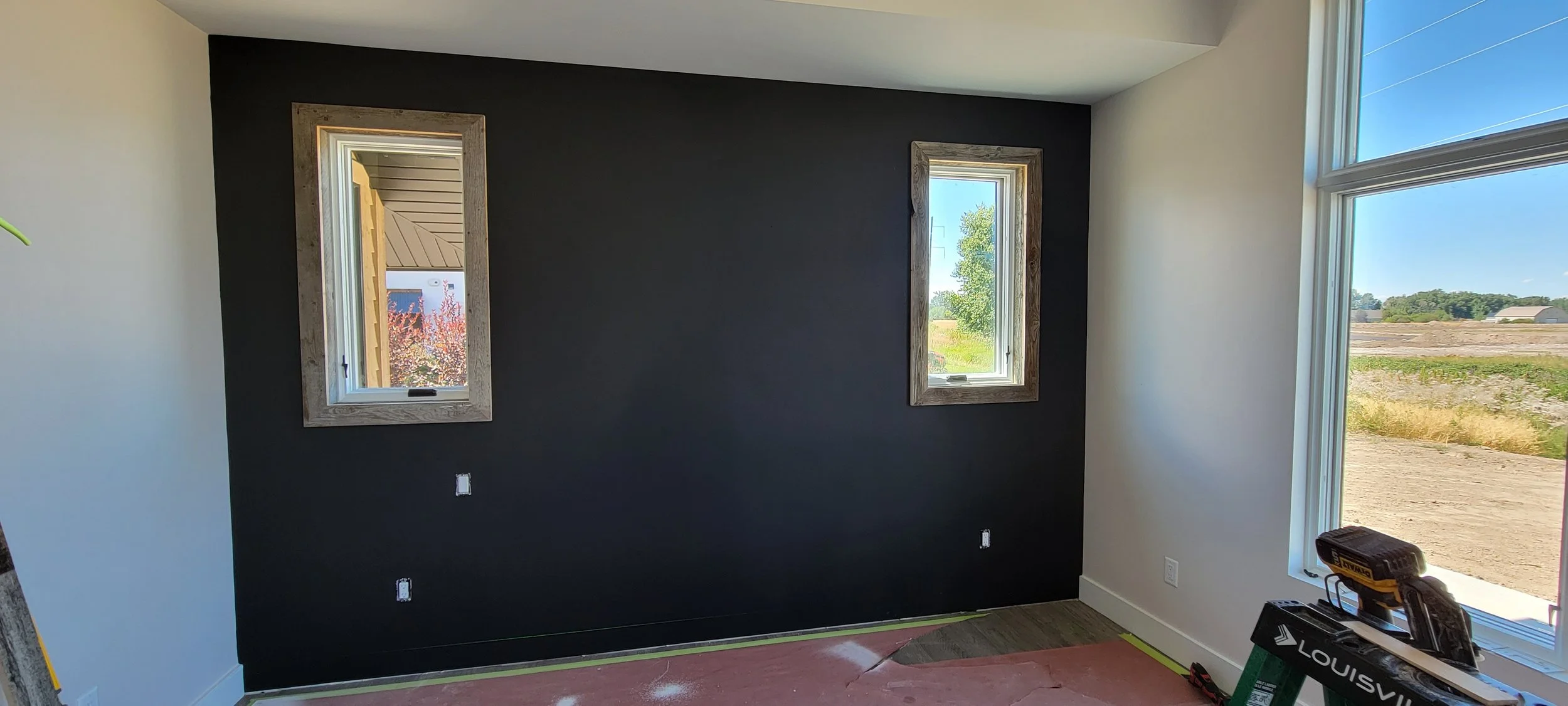 Barnwood feature wall with barn wood window casings