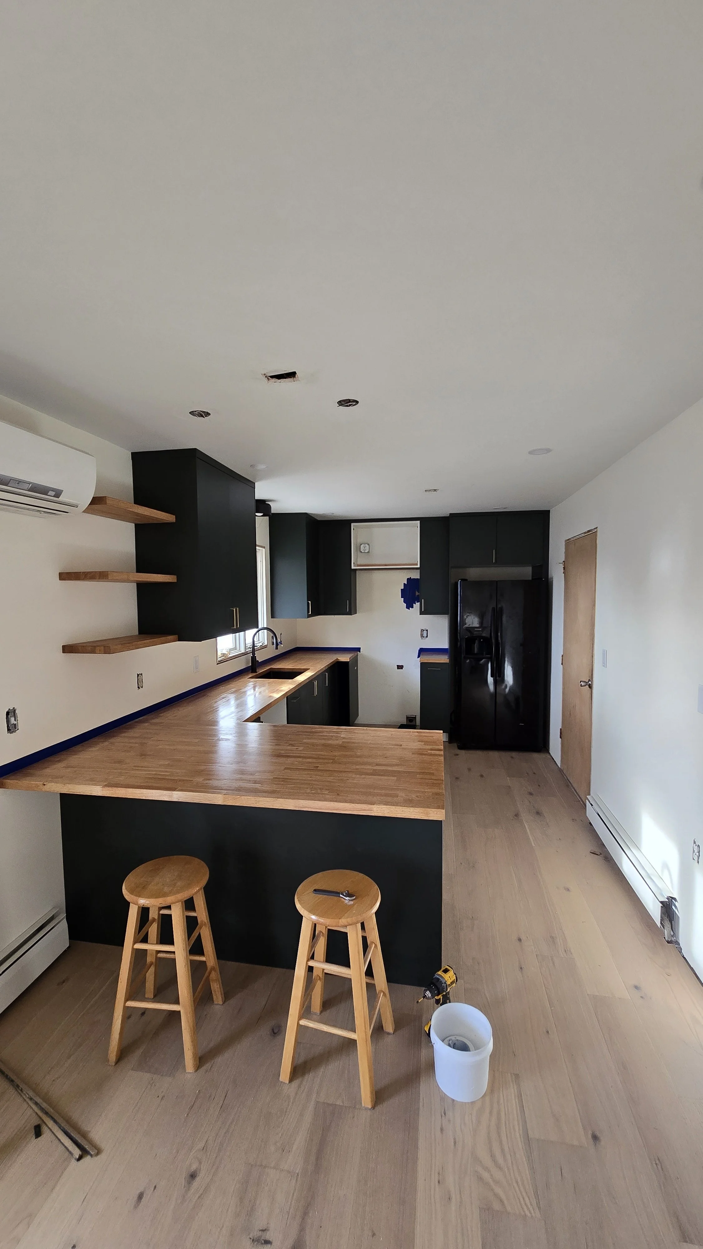 Kitchen install with butcher block countertop and undermount sink