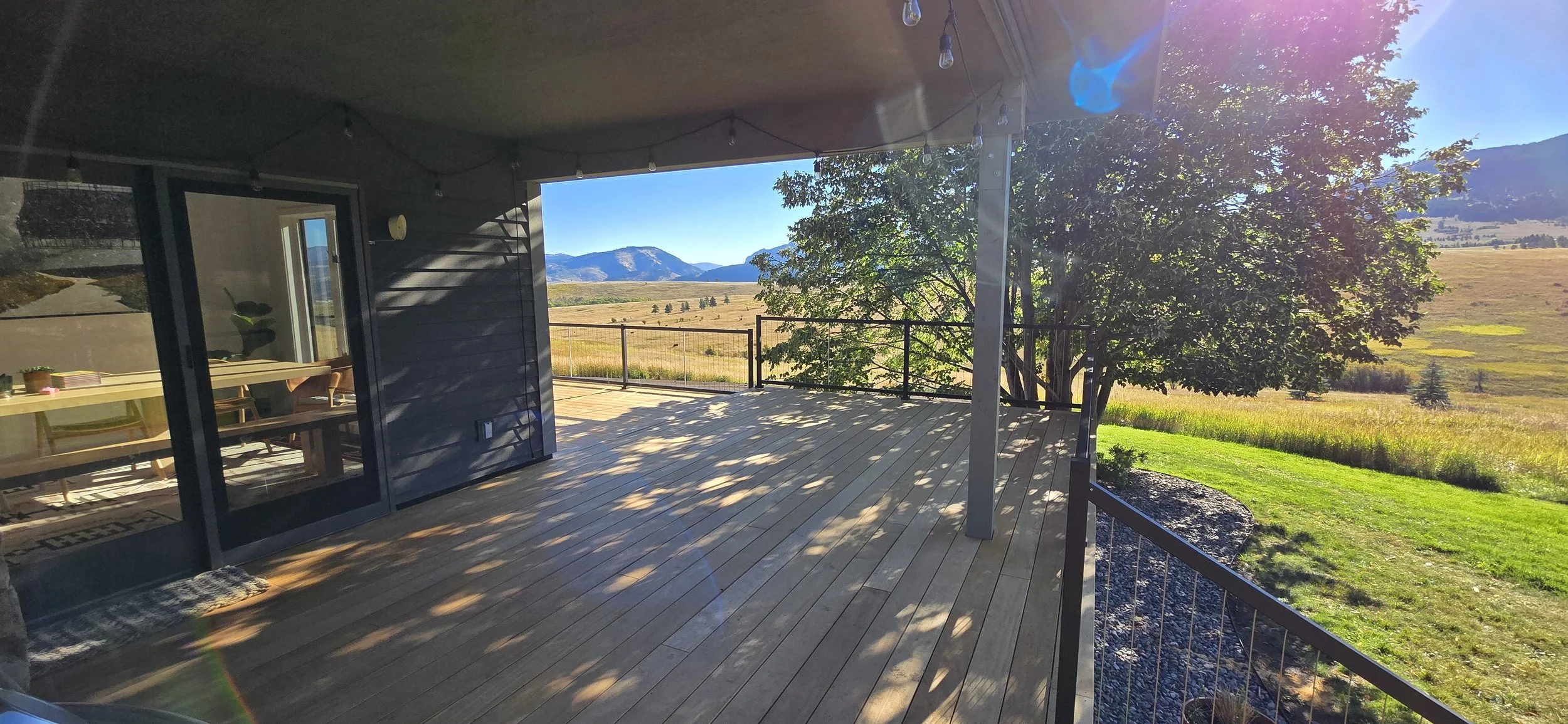 Finsihed deck remodel with garapa hardwood decking and Cable Bullet handrails