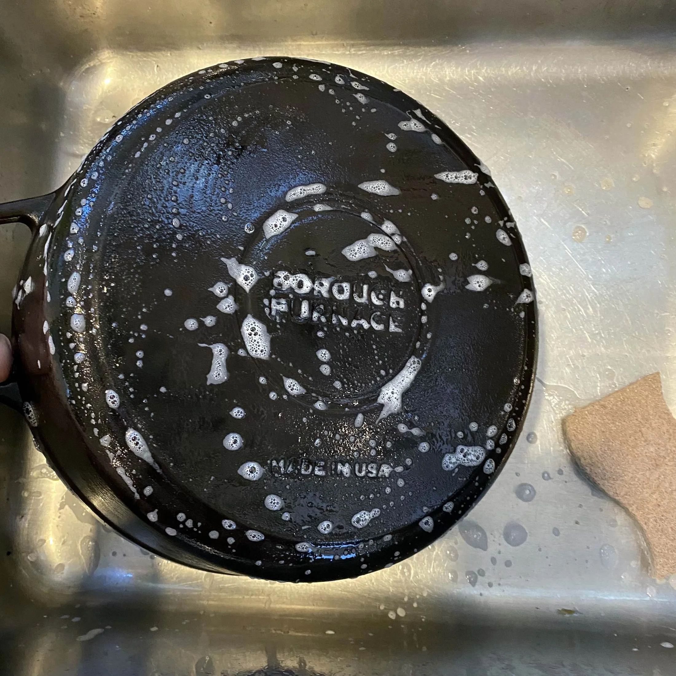Washing a cast iron Dutch oven in the sink
