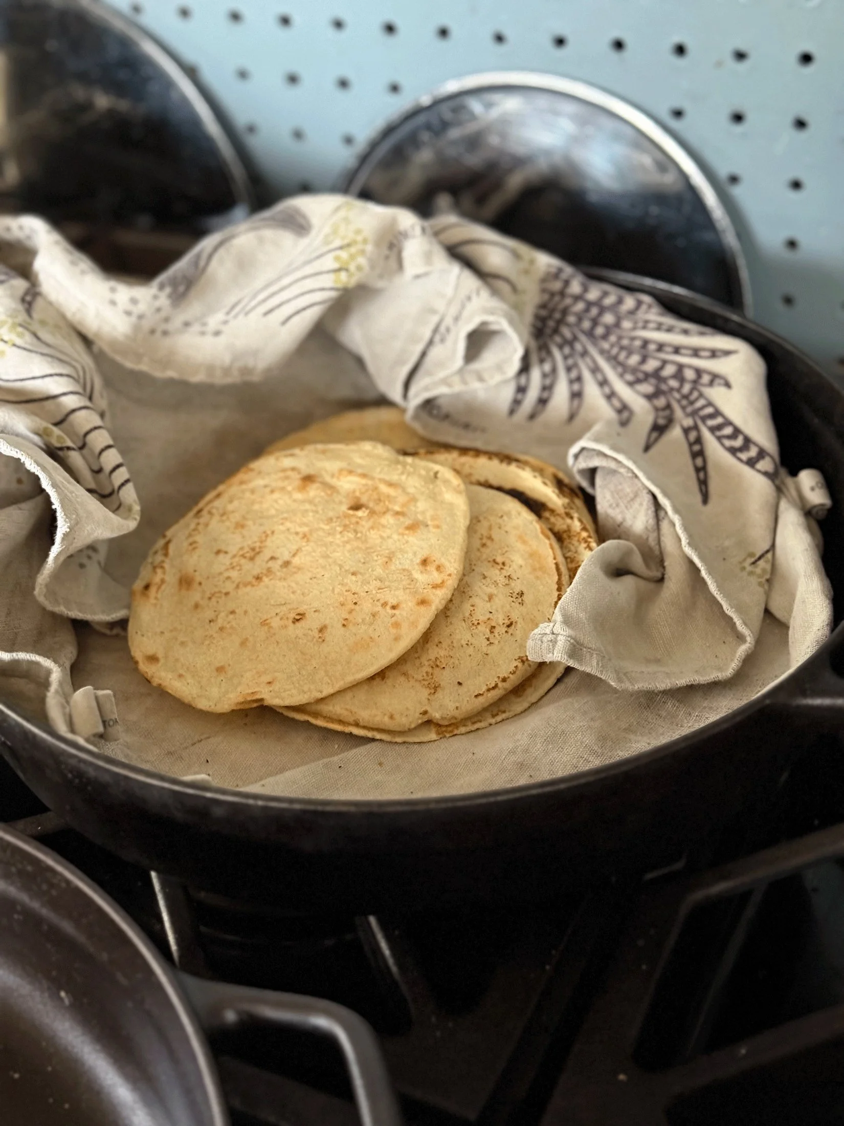 Fresh tortillas in a cozy towel