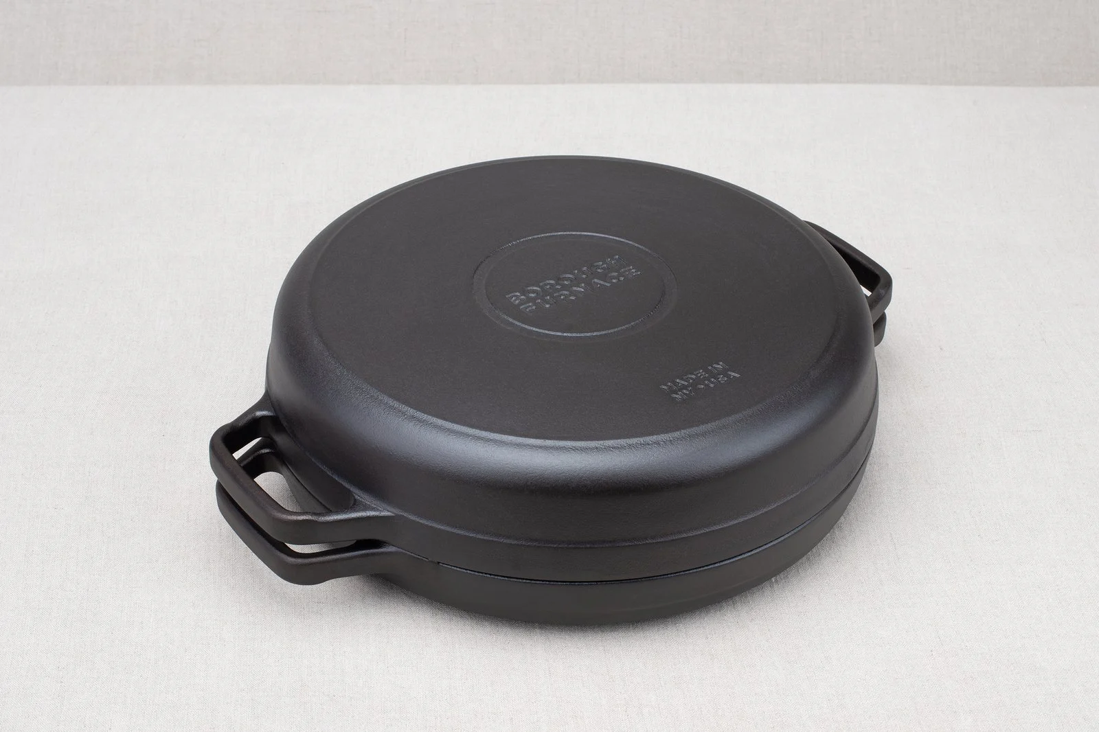 Borough Furnace 12-inch cast iron braising skillet side view showing loop handles