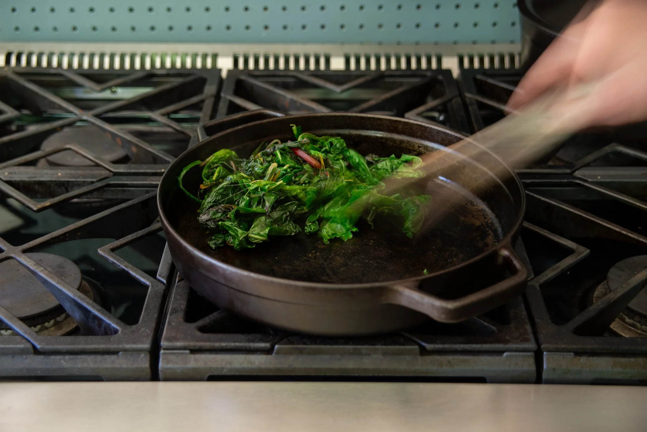 Greens cooking in a cast irong skillet