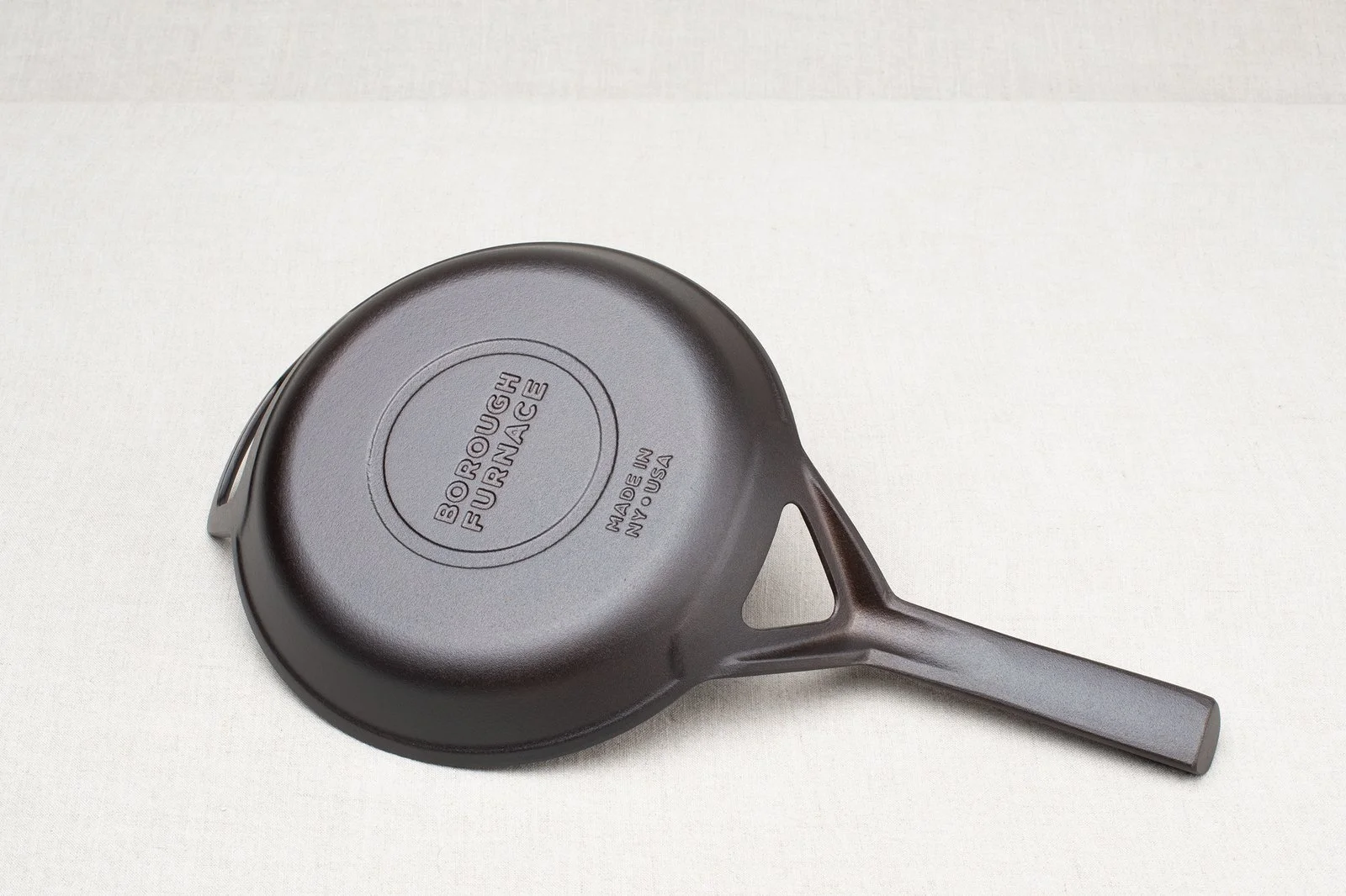 Bottom of Borough Furnace 9-inch cast iron skillet showing maker's mark and Made in USA stamp