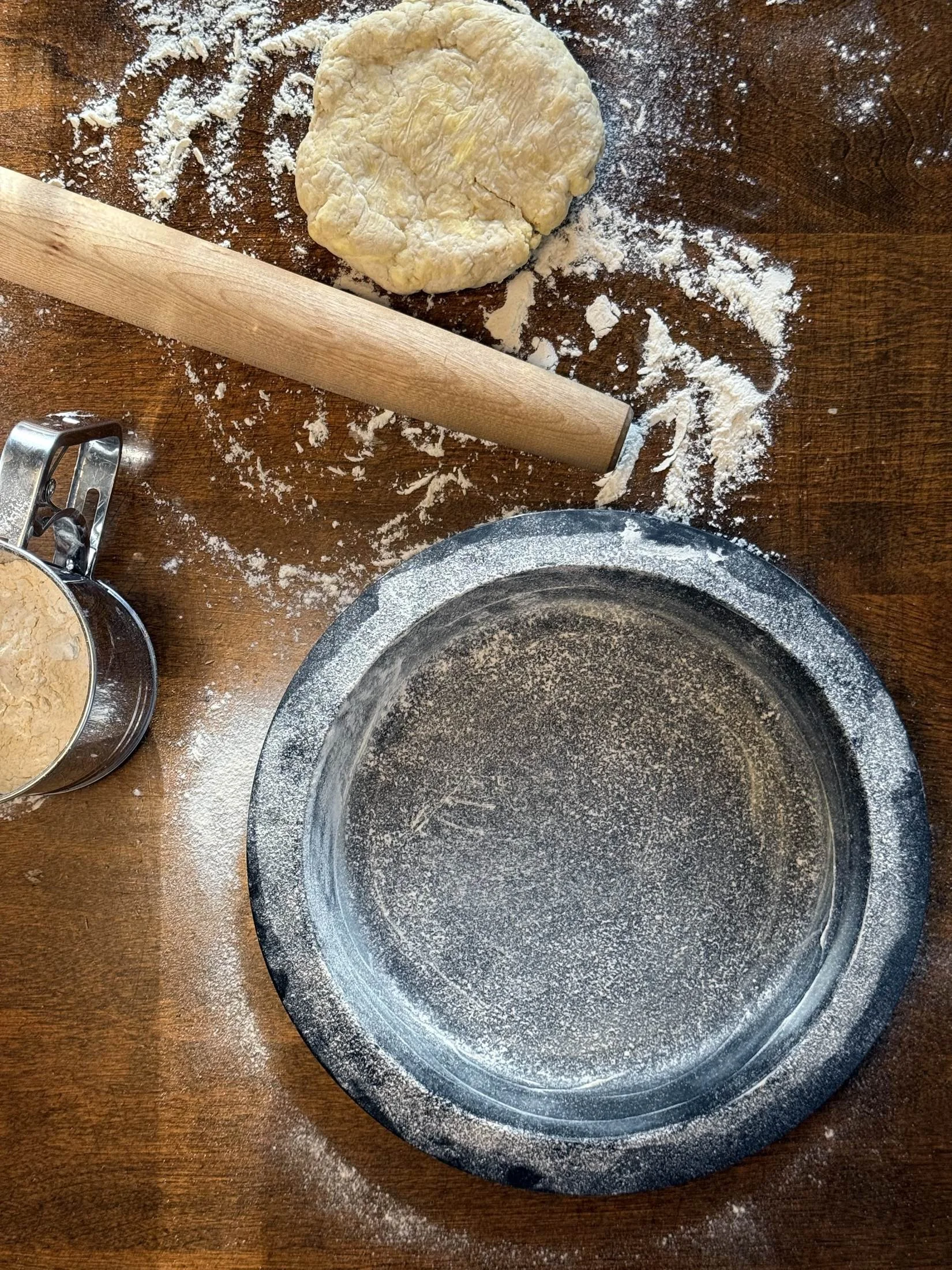 Cast iron pie pan floured and ready for crust