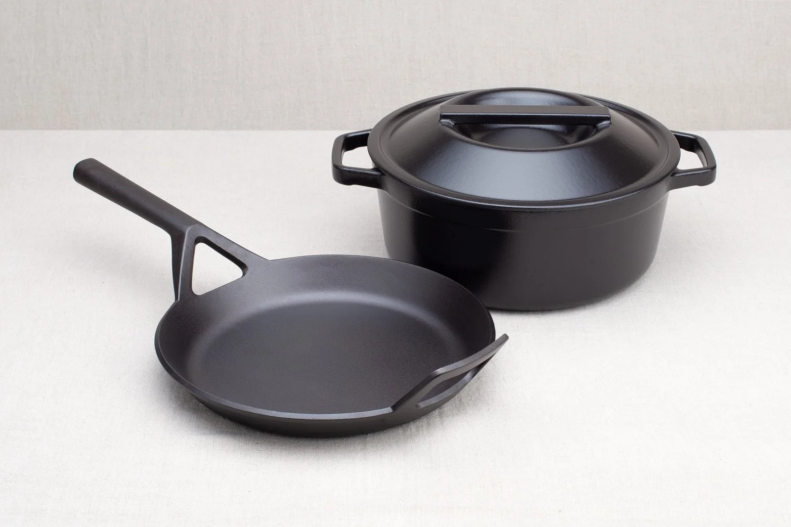 Borough Furnace cast iron essentials bundle — frying skillet and dutch oven on linen background
