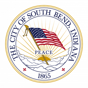 Seal of the City of South Bend, Indiana, featuring a waving American flag, an umbrella, the word PEACE, and the year 1865.