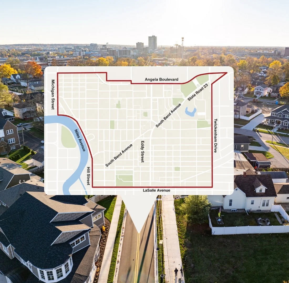 A map overlay showing a neighborhood boundary with street names and a river, placed over an aerial view of a residential neighborhood with trees and houses.