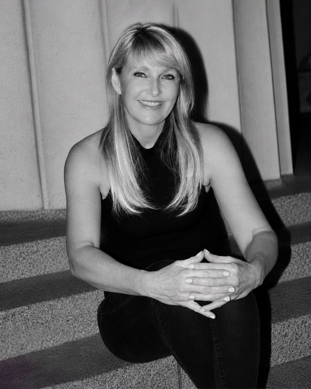 Psychologist Sara Chatwin sitting on steps
