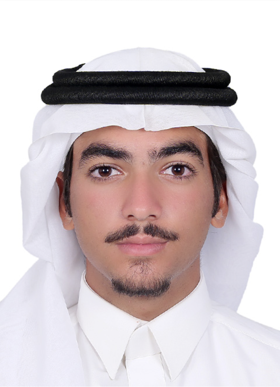 Close-up photo of a young man wearing traditional Middle Eastern attire, including a white keffiyeh with a black agal on his head, and a white thobe.