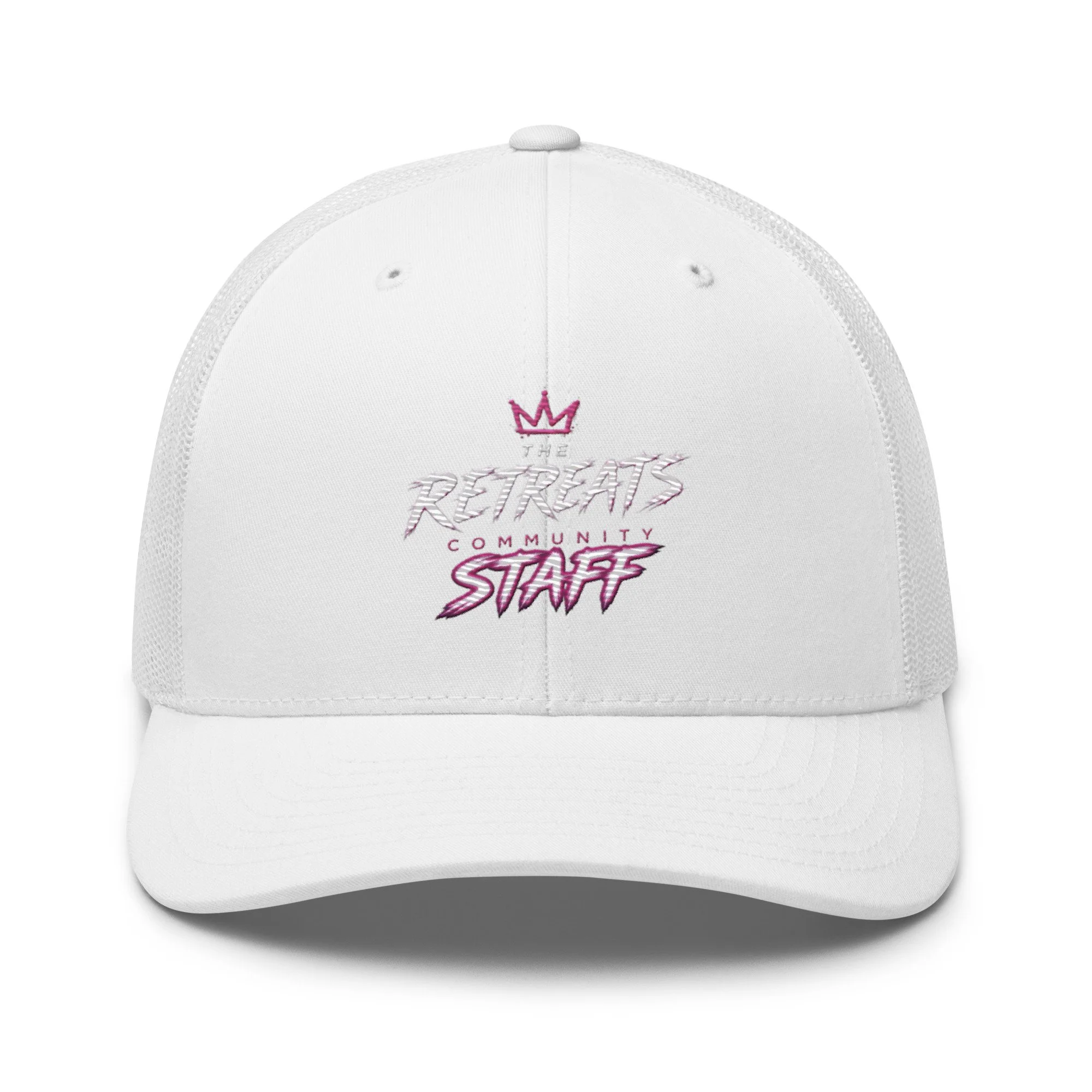 White baseball cap with embroidered pink crown and text reading 'The Retreat Community Staff' on the front