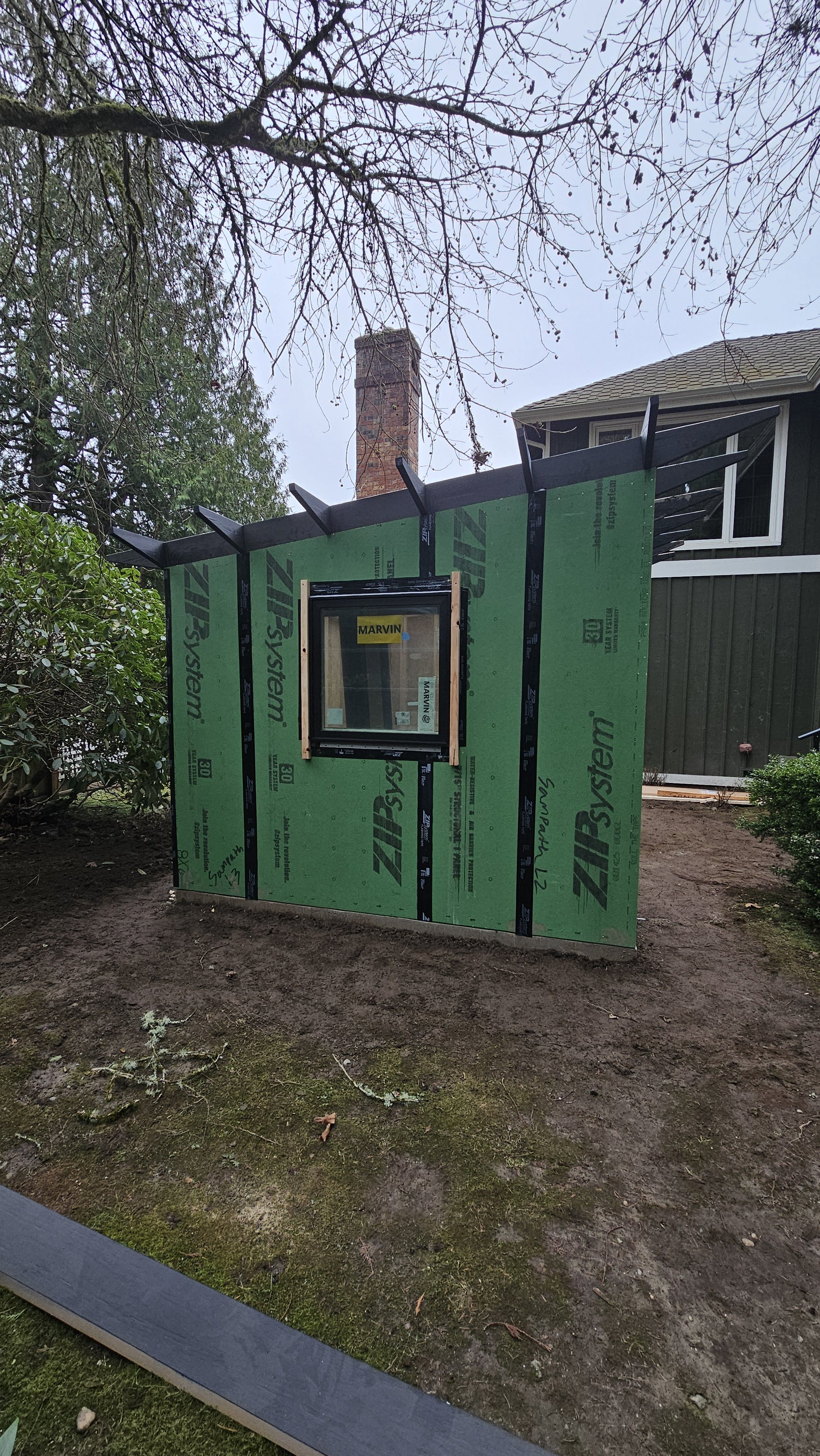 STUDIO SHED 4 structure erected without roof. Showing waterproofing