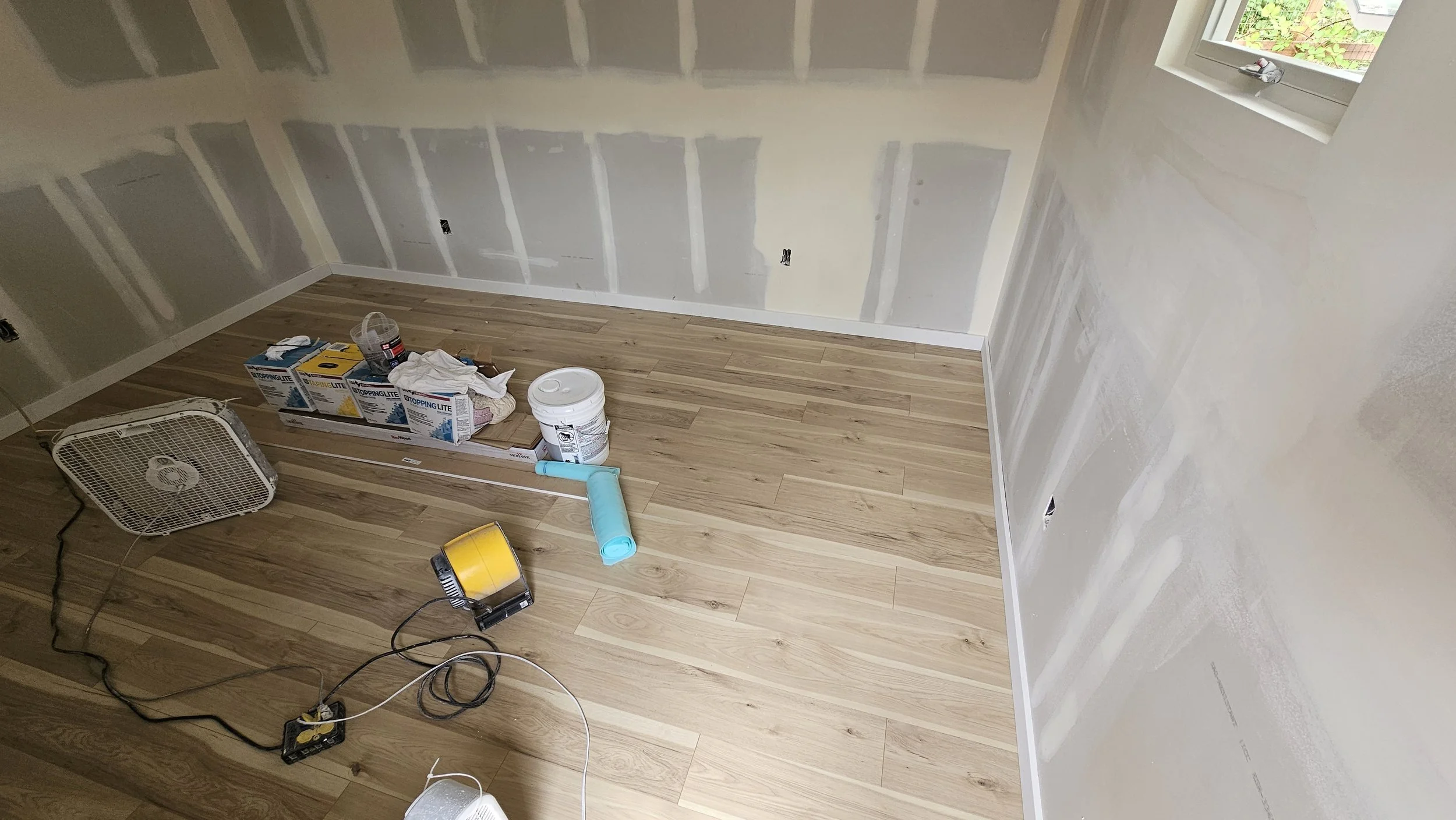 STUDIO SHED 2 insulated, drywall taped and muddled, floor completed