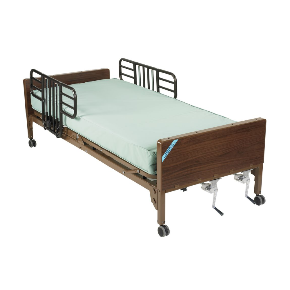 A hospital bed with wooden head and footboards, metal side rails, a light green mattress, and wheels for mobility.