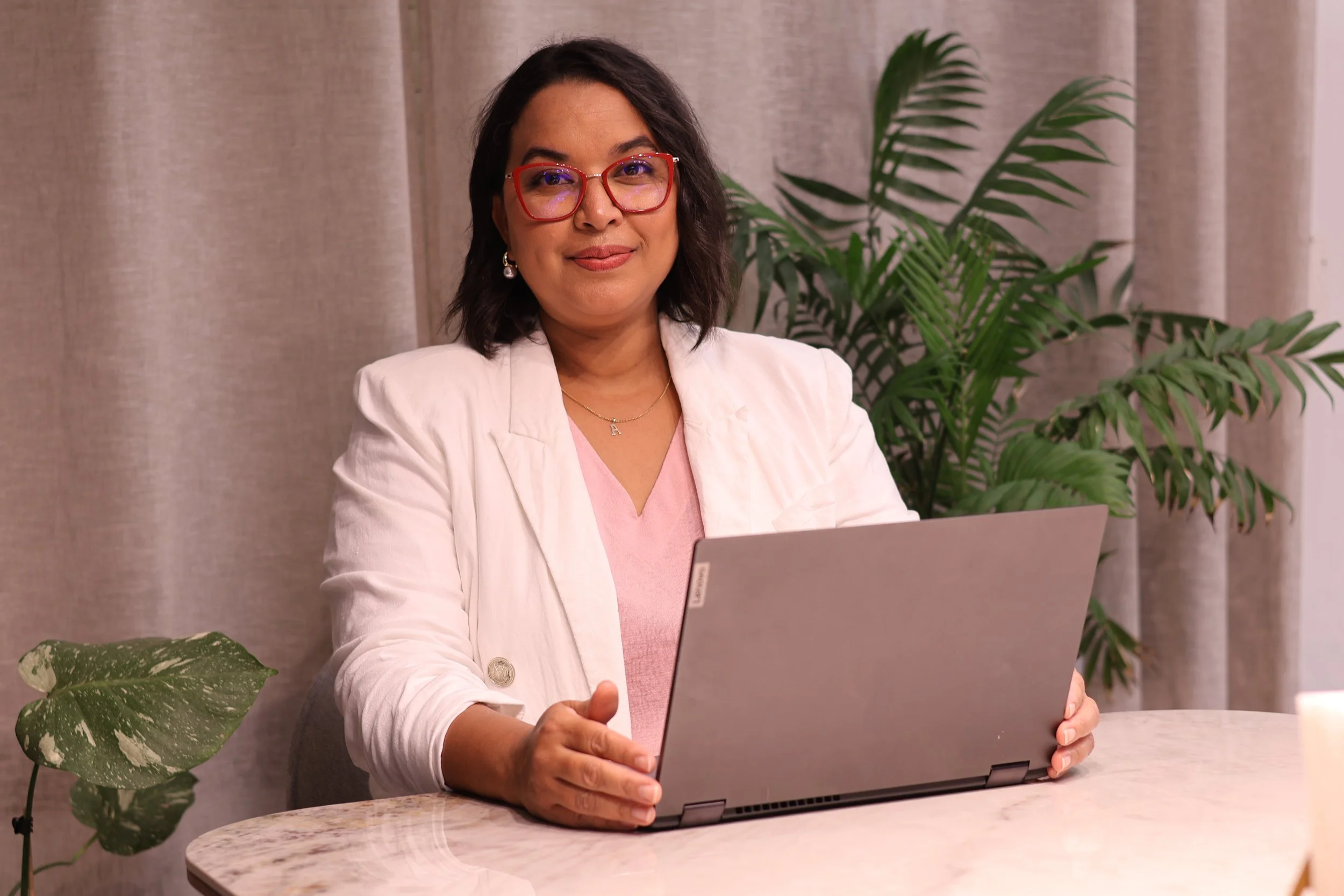 Audrey Mobbs, qualified counsellor and founder of Ready For Love Co, working at her laptop.