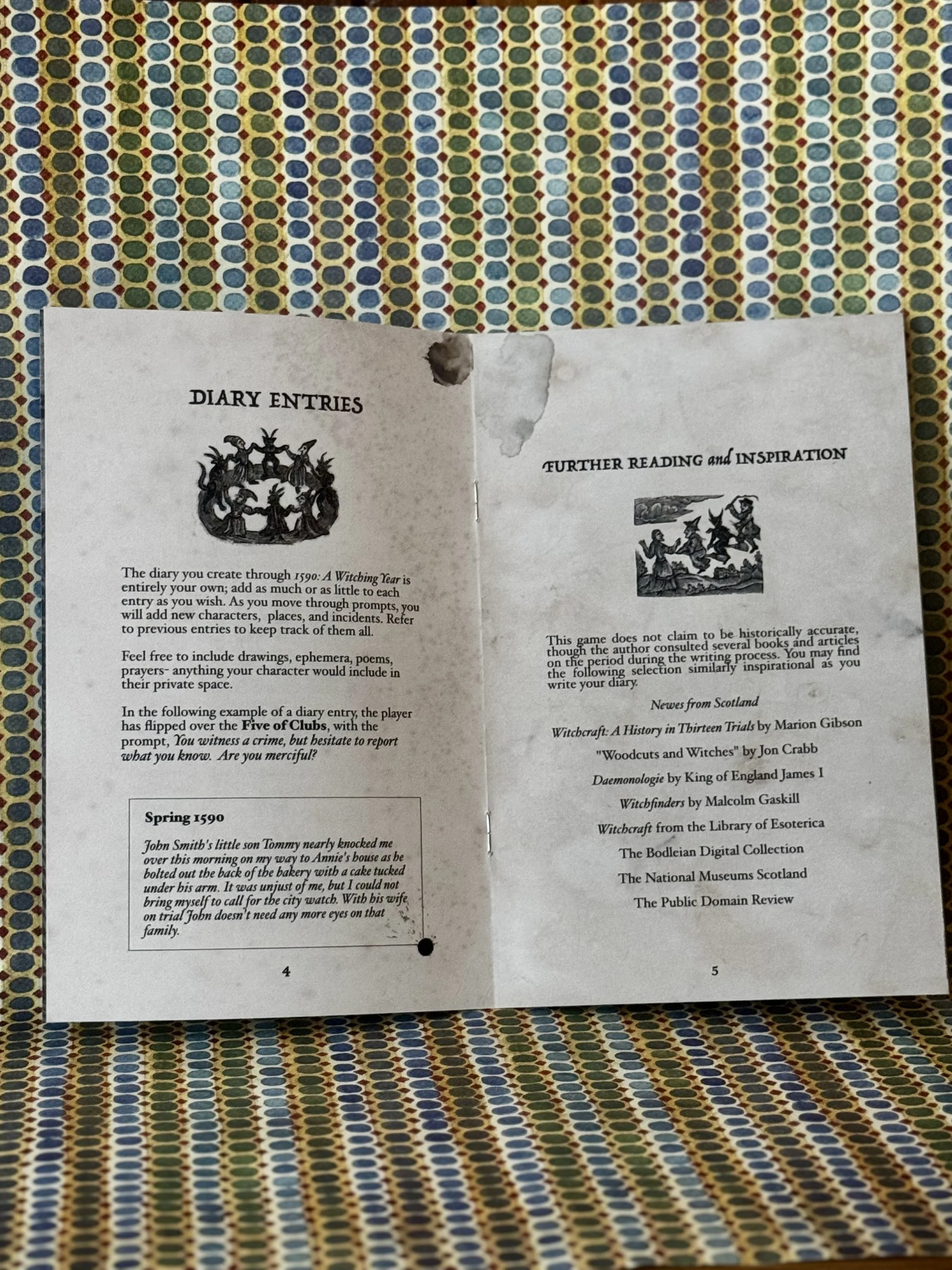 Quatis Press game 1590 A Witching Year solo journaling game interior pages, showing a spread of game play with journaling prompts and woodcuts.