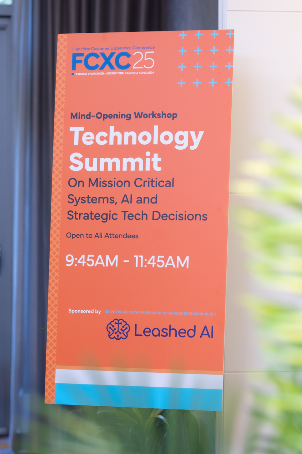 Poster for the FCXC 25 Technology Summit, a workshop on mission critical systems, AI, and strategic tech decisions, sponsored by Leashed AI, from 9:45 AM to 11:45 AM.