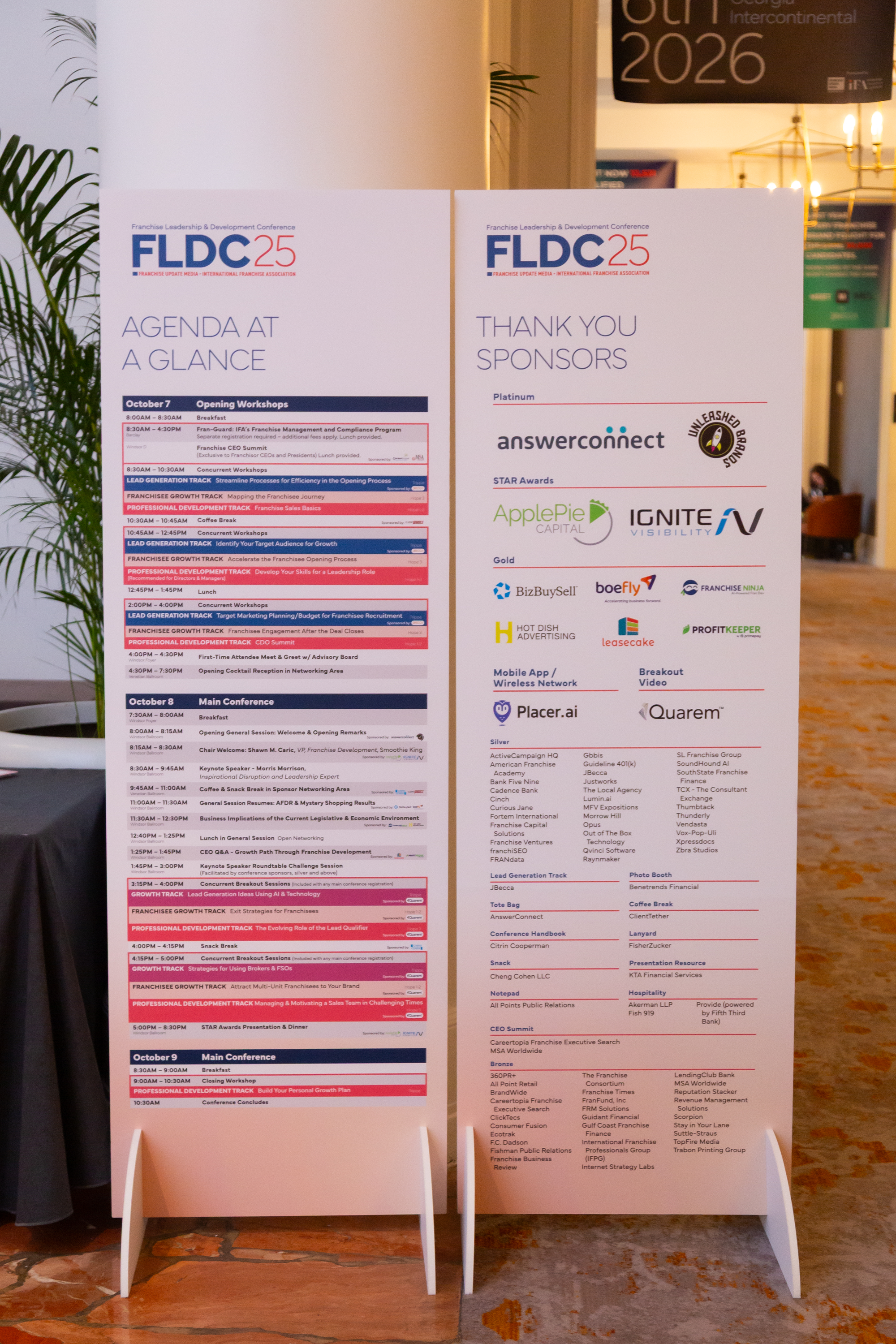 Conference agenda and sponsor thank you boards for FLDC 25 at a franchise leadership and development event. The agenda lists sessions and workshops scheduled for October 7-9, along with sponsor logos such as AnswerConnect, ApplePie Capital, and various others.