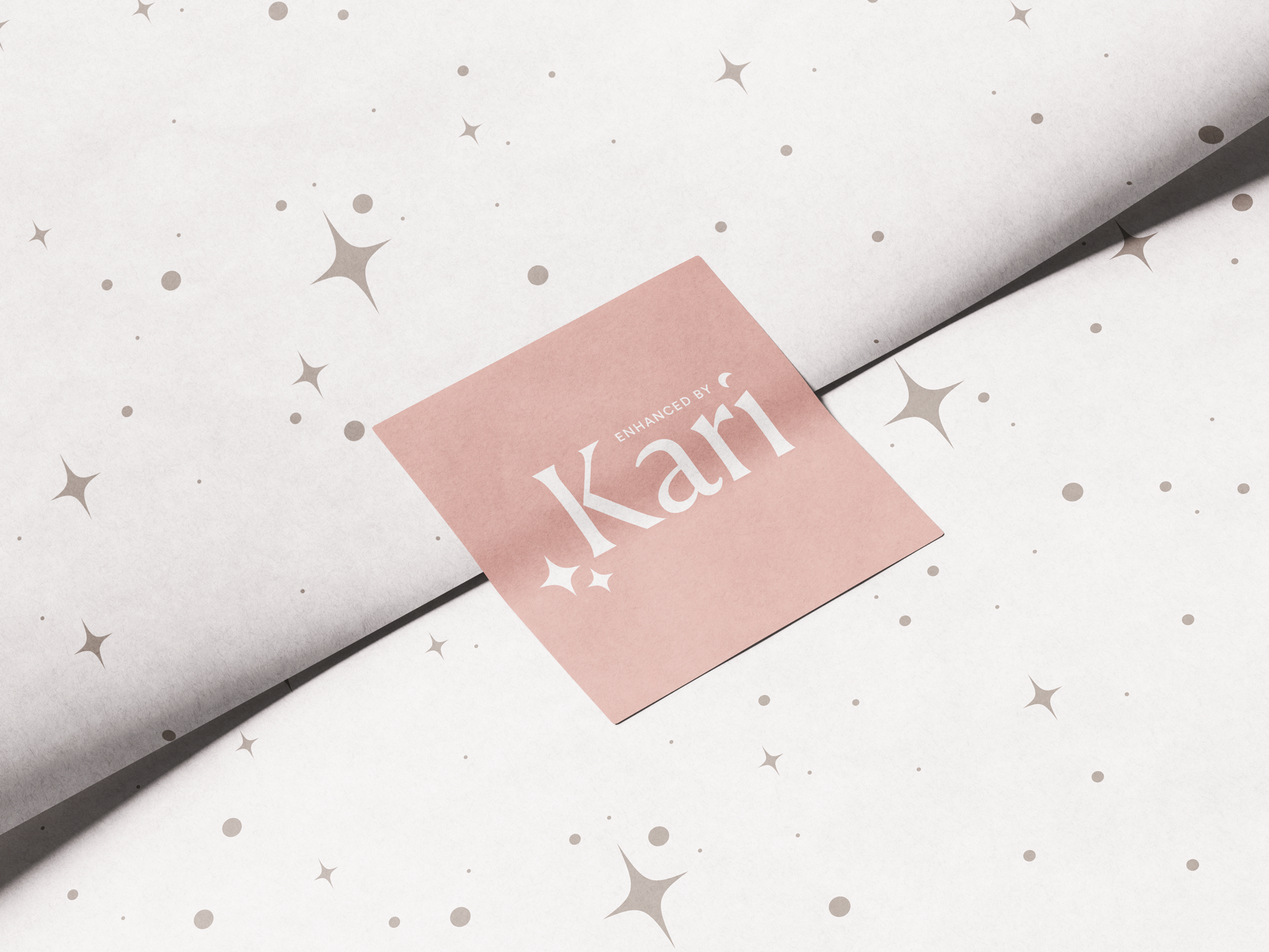 A pink card with the word 'Kar...' partially visible and a star icon, placed on a star-patterned surface with a shadow cast over part of it.