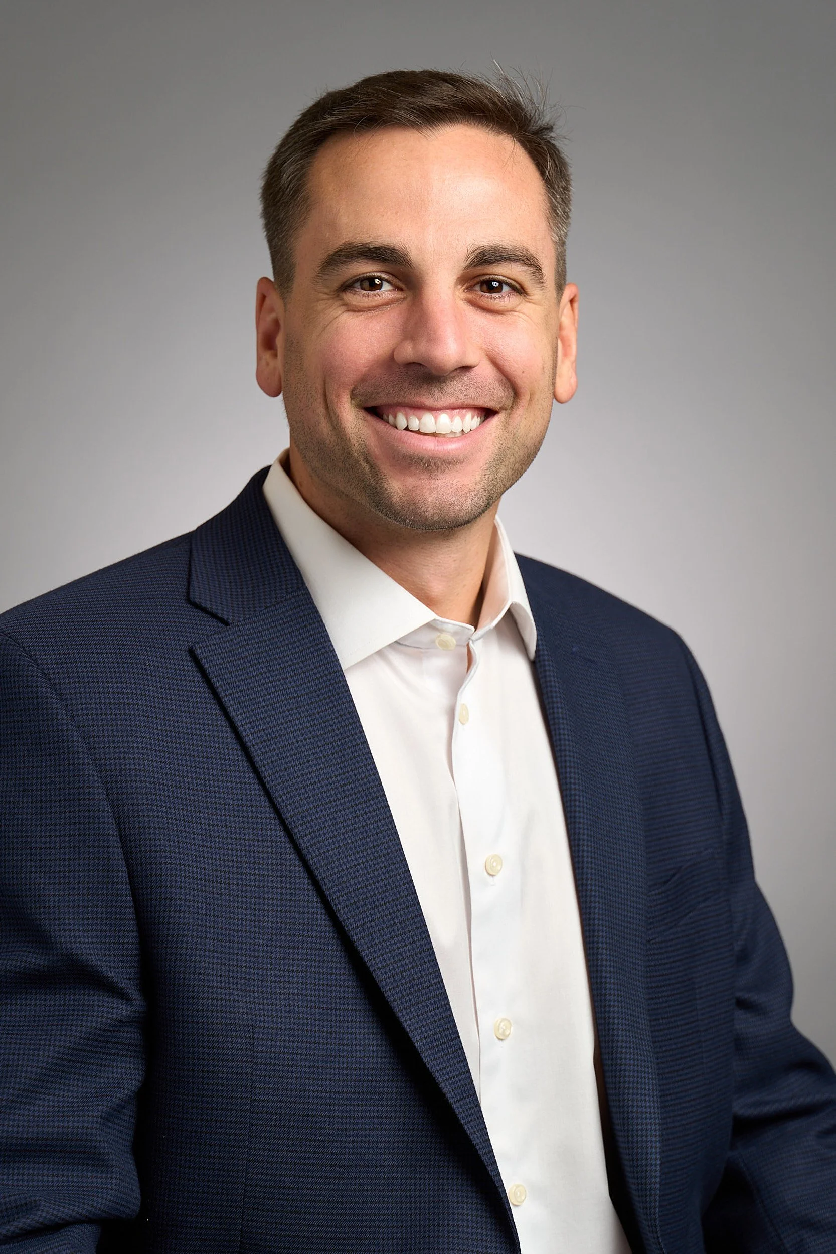 Corporate portrait of male executive in professional setting by Arsen Vasquez Photography