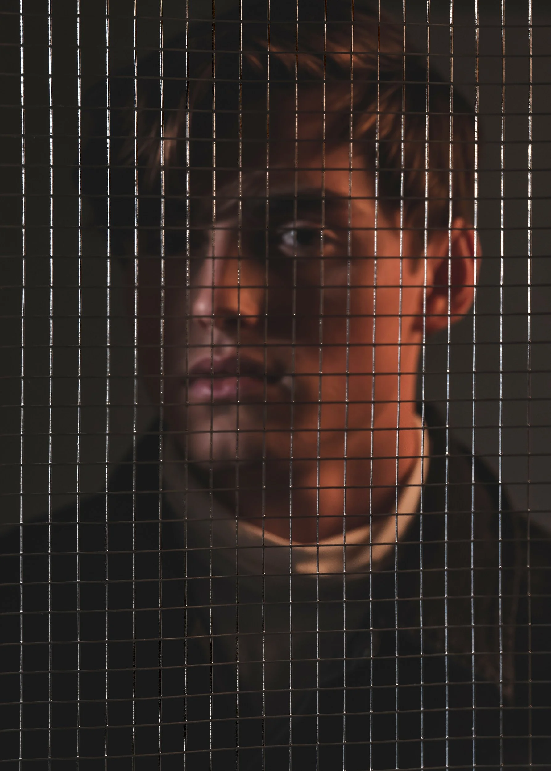 Dark grid overlay editorial portrait of  actor Spencer List by commercial photographer Arsen Vasquez styled by Langy
